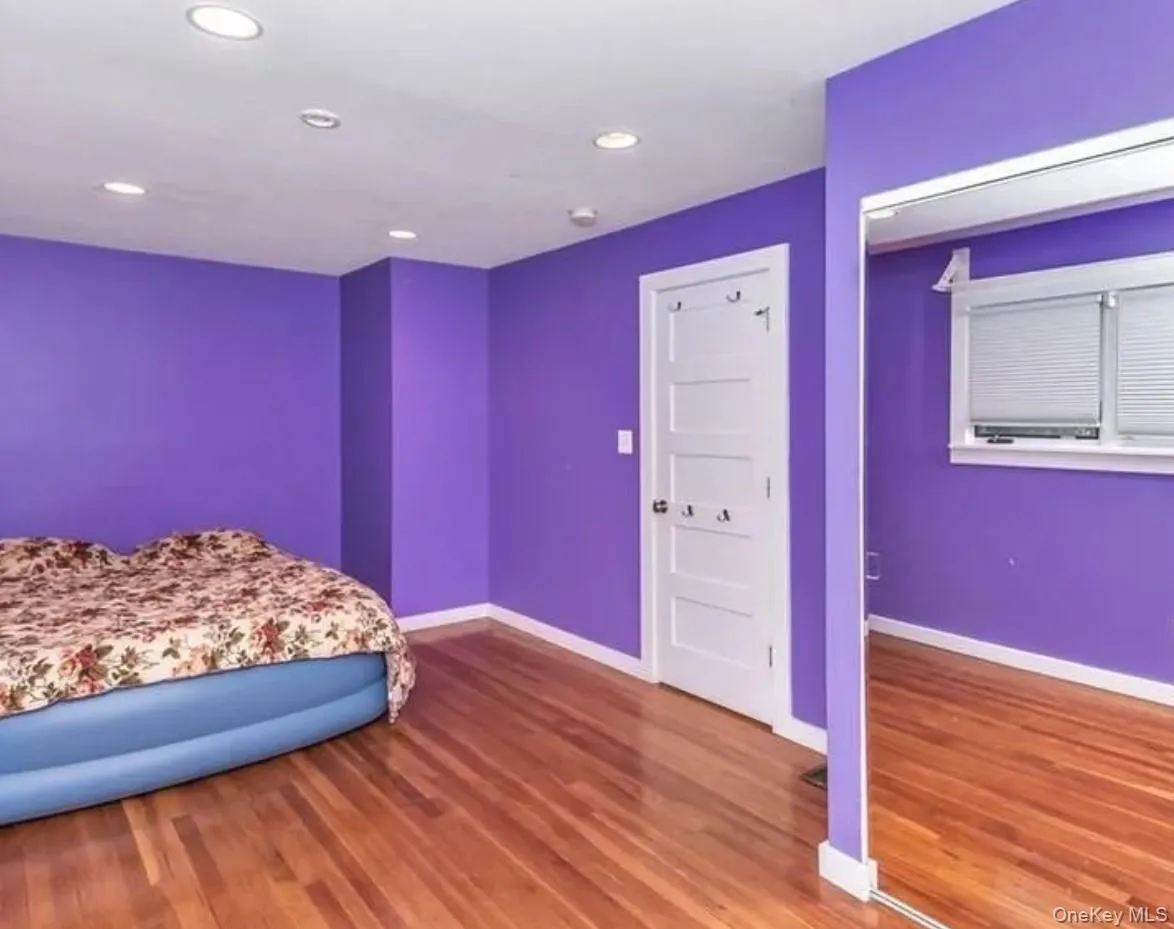 Bedroom with recessed lighting and wood finished floors Bedroom with recessed lighting and wood finished floors