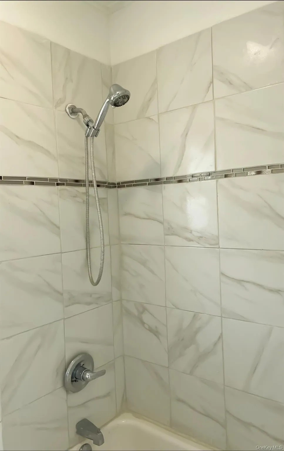 Bathroom featuring shower / bathtub combination Bathroom featuring shower / bathtub combination