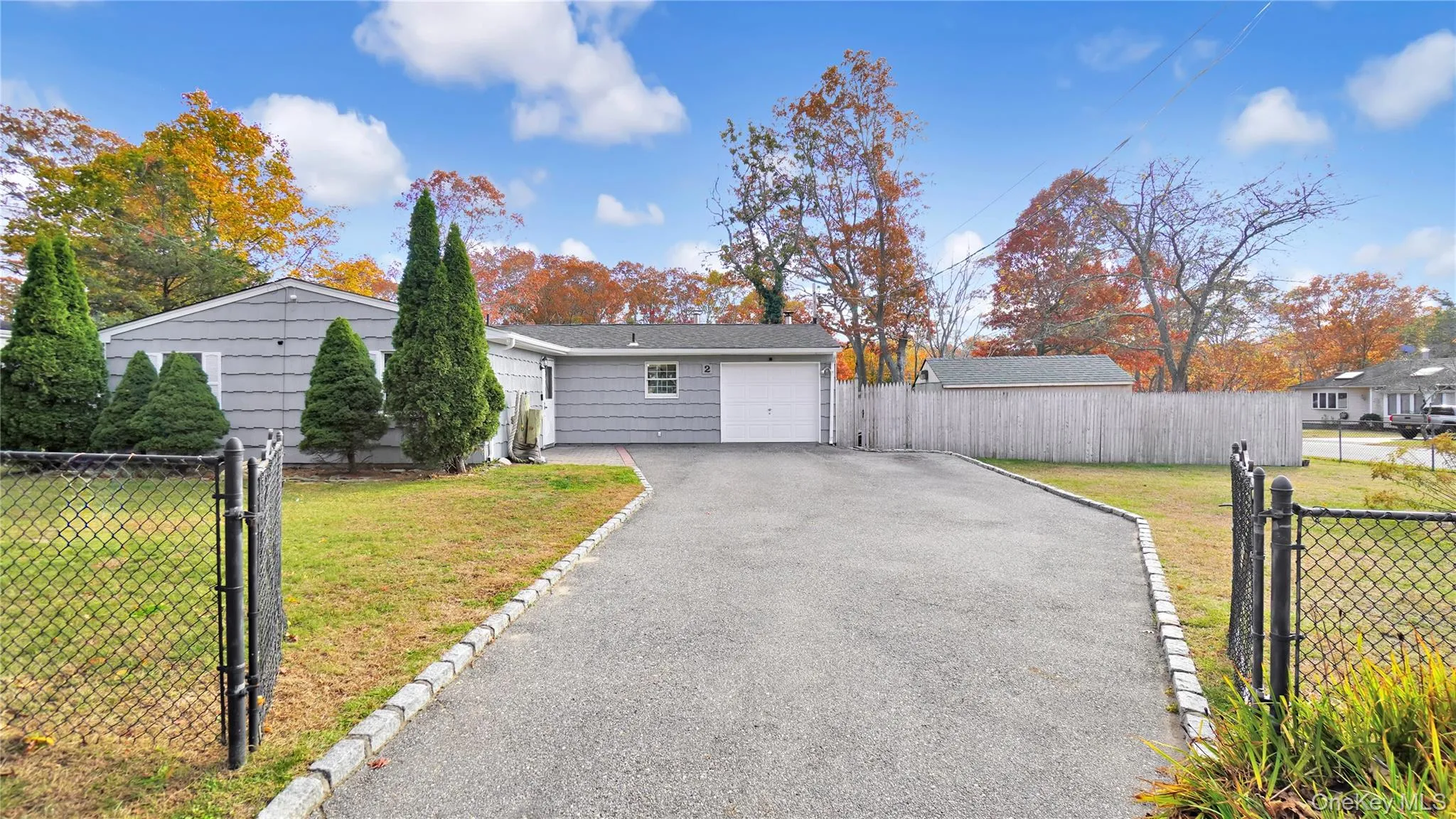 View of front of house with asphalt driveway and a gate View of front of house with asphalt driveway and a gate