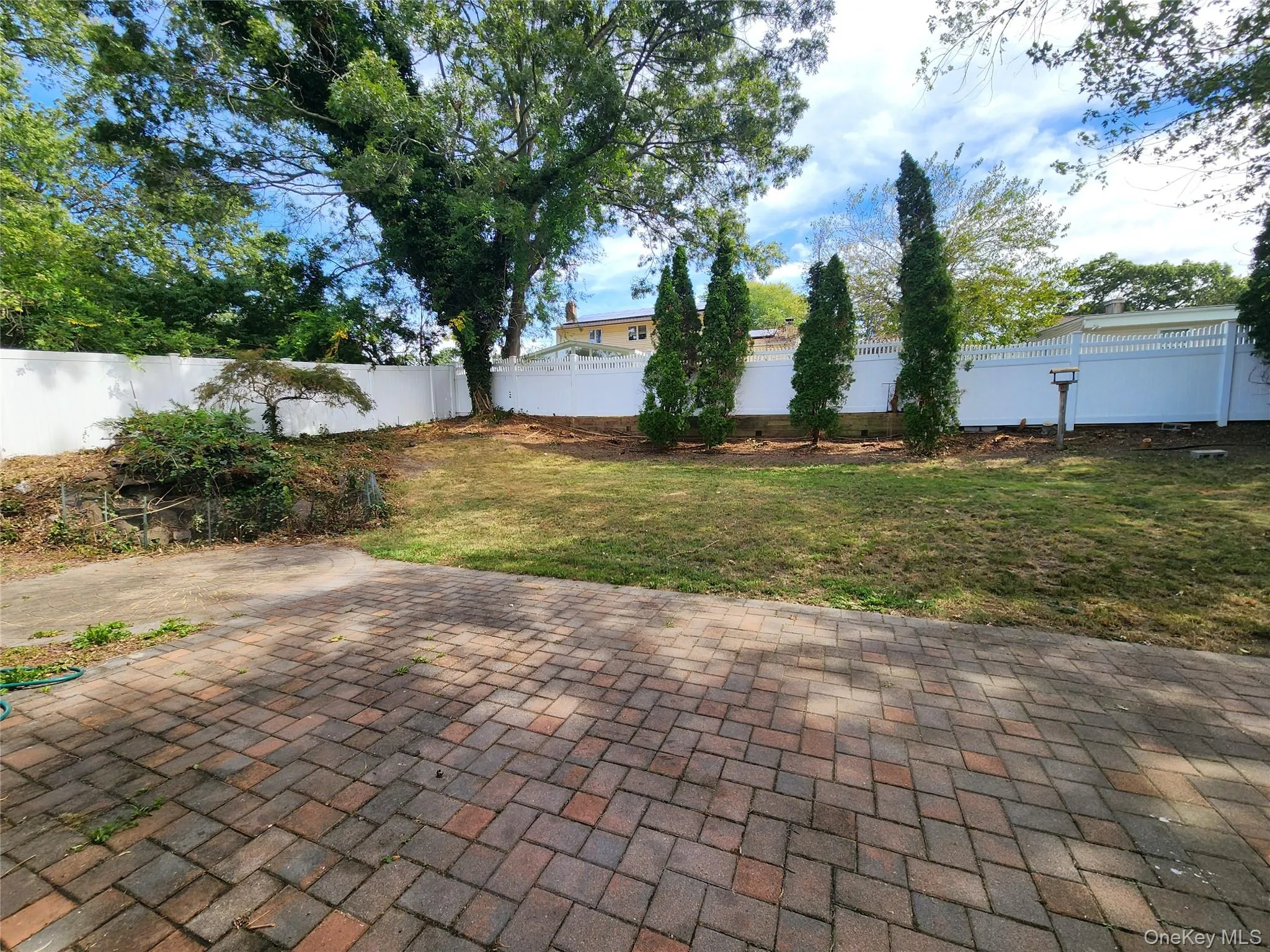 Fenced backyard featuring a patio Fenced backyard featuring a patio