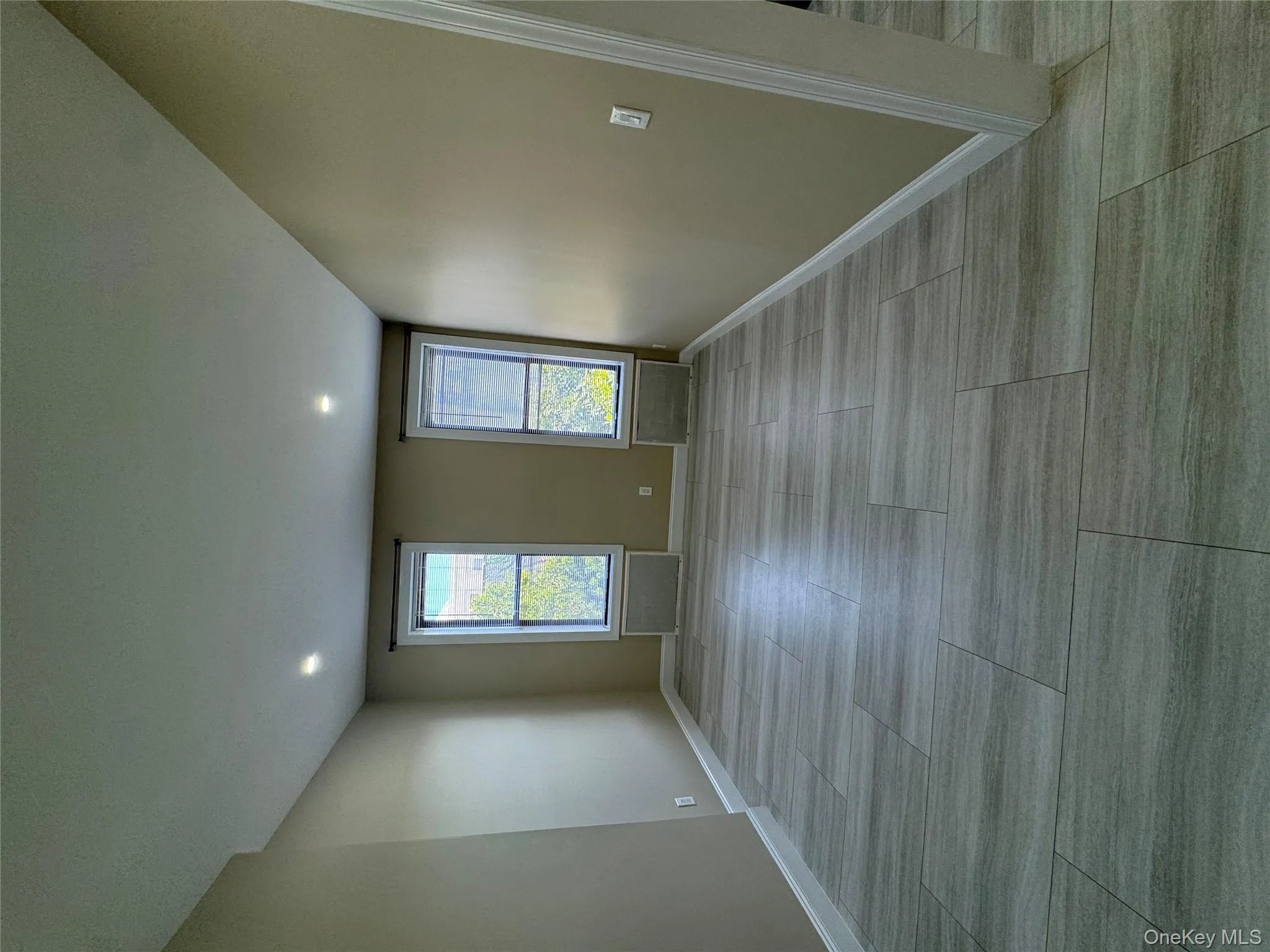 Empty room featuring baseboards and recessed lighting Empty room featuring baseboards and recessed lighting