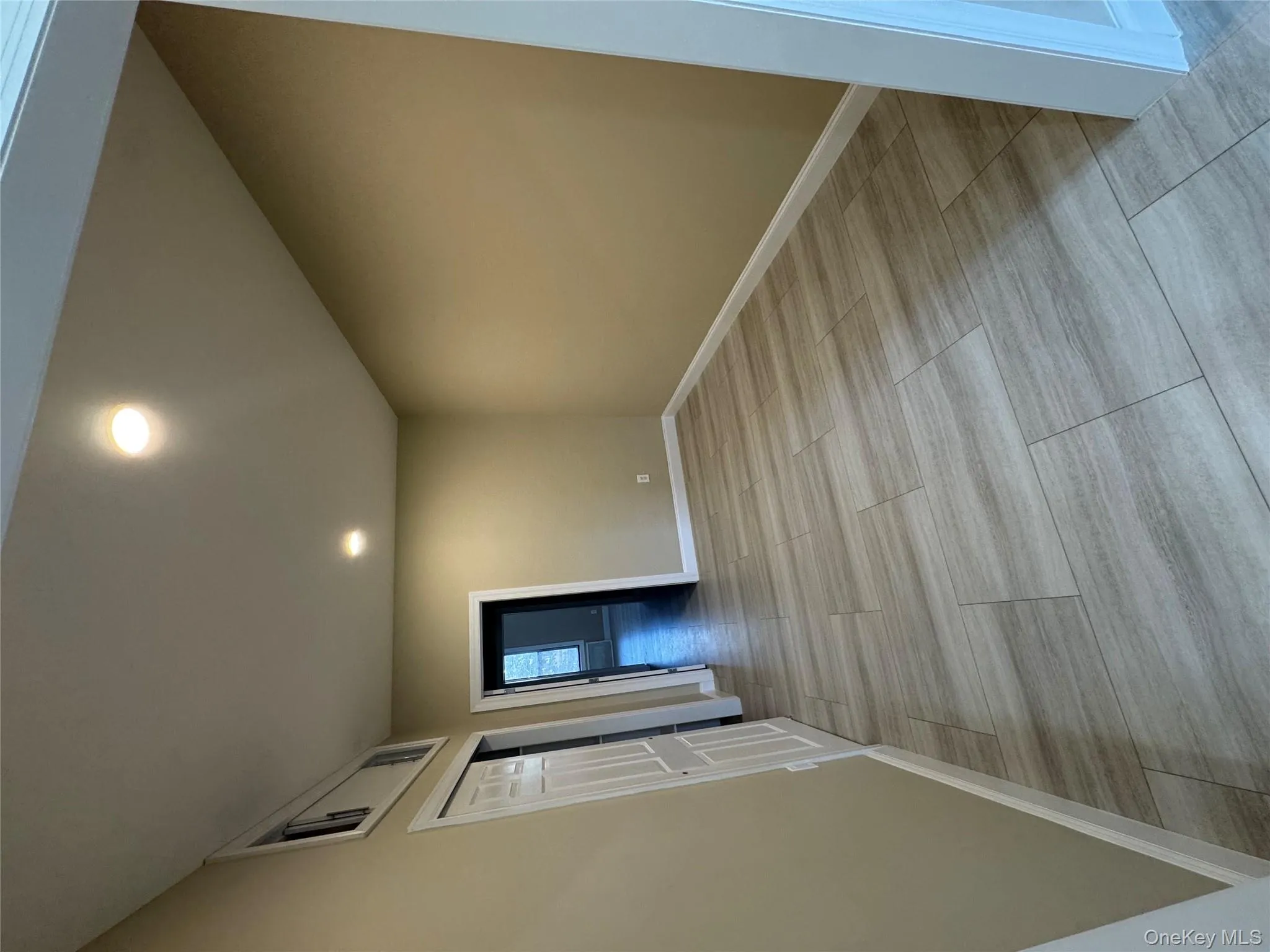 Spare room with recessed lighting and wood tiled floors Spare room with recessed lighting and wood tiled floors