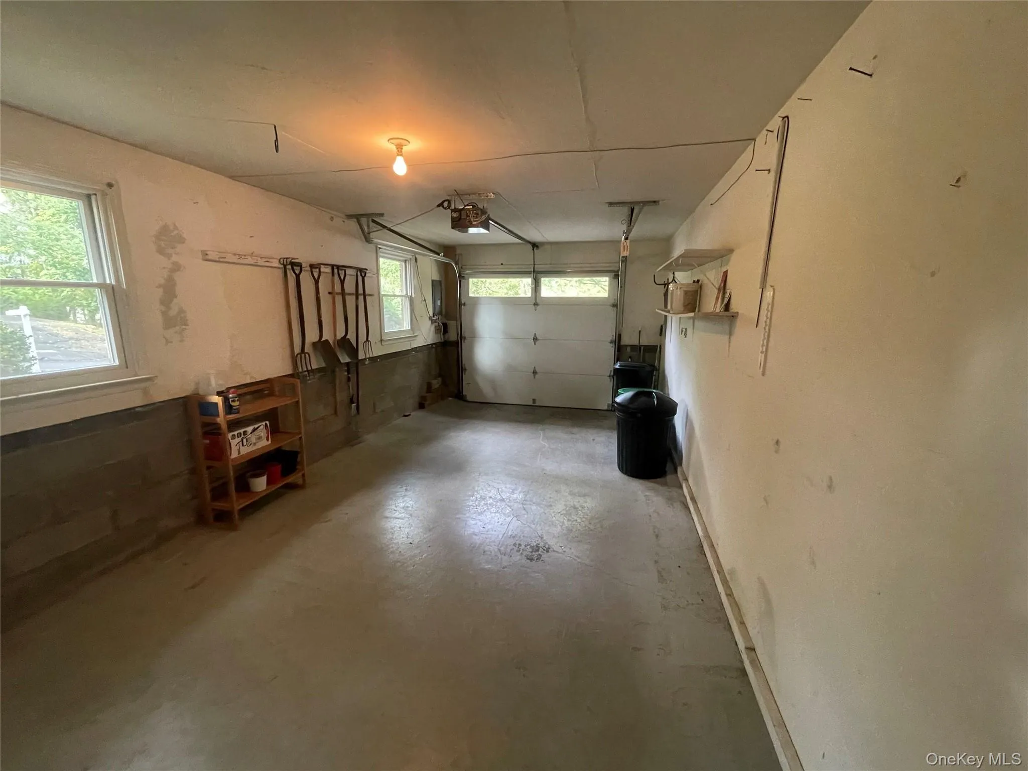 Garage featuring a garage door opener Garage featuring a garage door opener