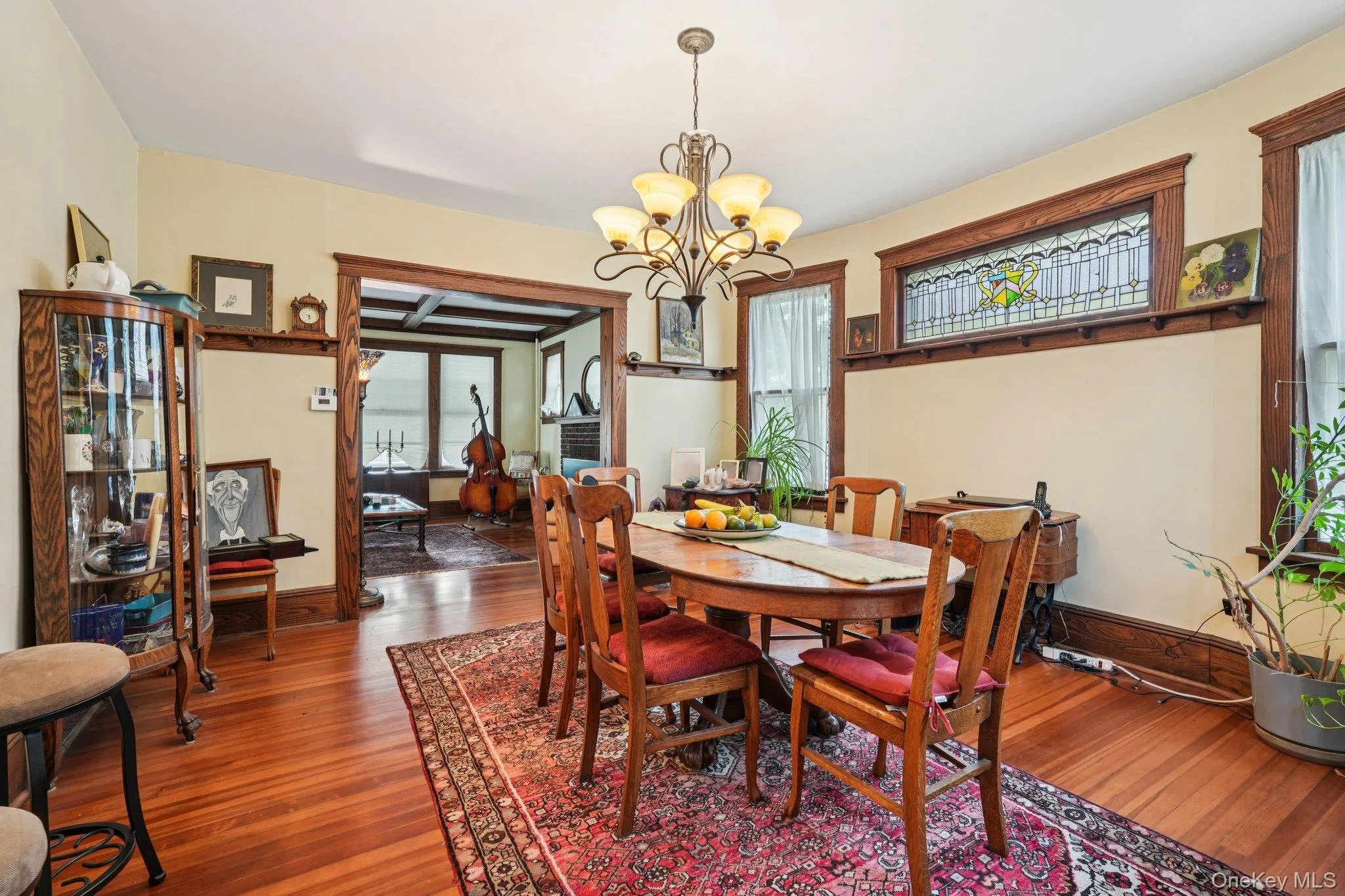 Dining room featuring a chandelier and wood finished floors Dining room featuring a chandelier and wood finished floors