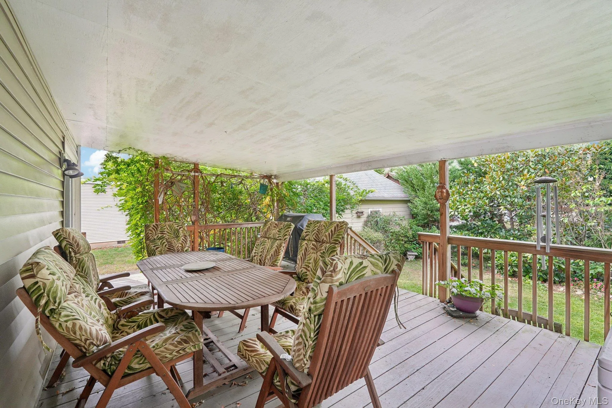 Deck with area for grilling and outdoor dining area Deck with area for grilling and outdoor dining area