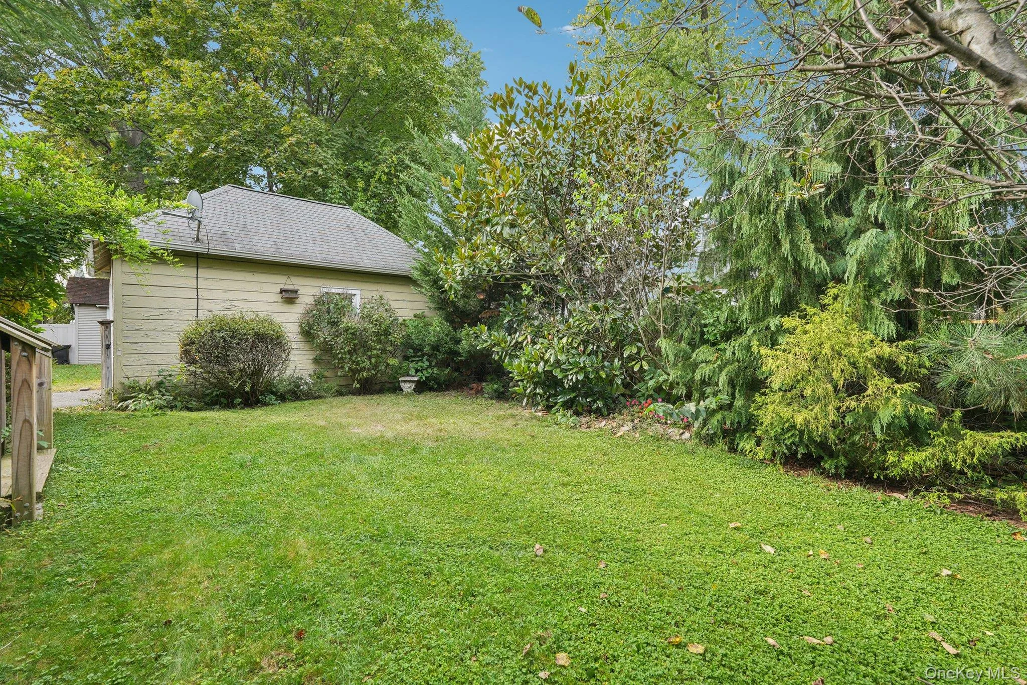 View of grassy yard with view of scattered trees View of grassy yard with view of scattered trees