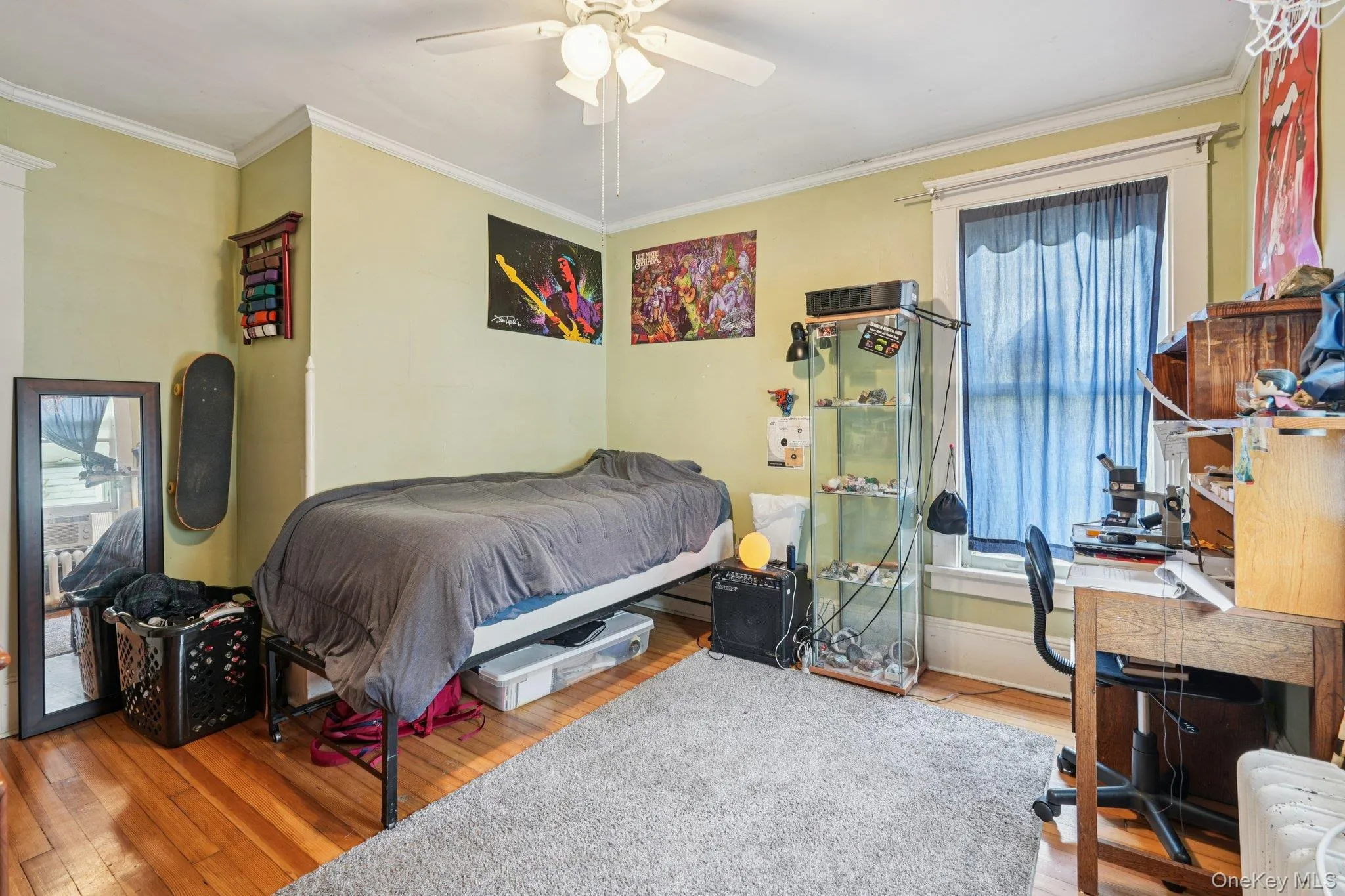 Bedroom featuring crown molding, hardwood / wood-style flooring, an office area, and ceiling fan Bedroom featuring crown molding, hardwood / wood-style flooring, an office area, and ceiling fan