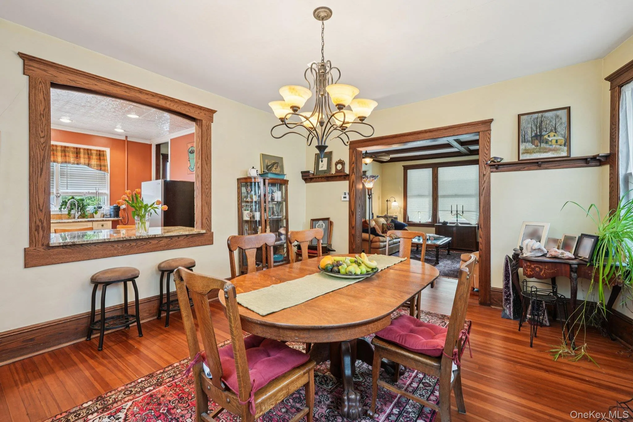 Dining room with hardwood / wood-style floors and a chandelier Dining room with hardwood / wood-style floors and a chandelier