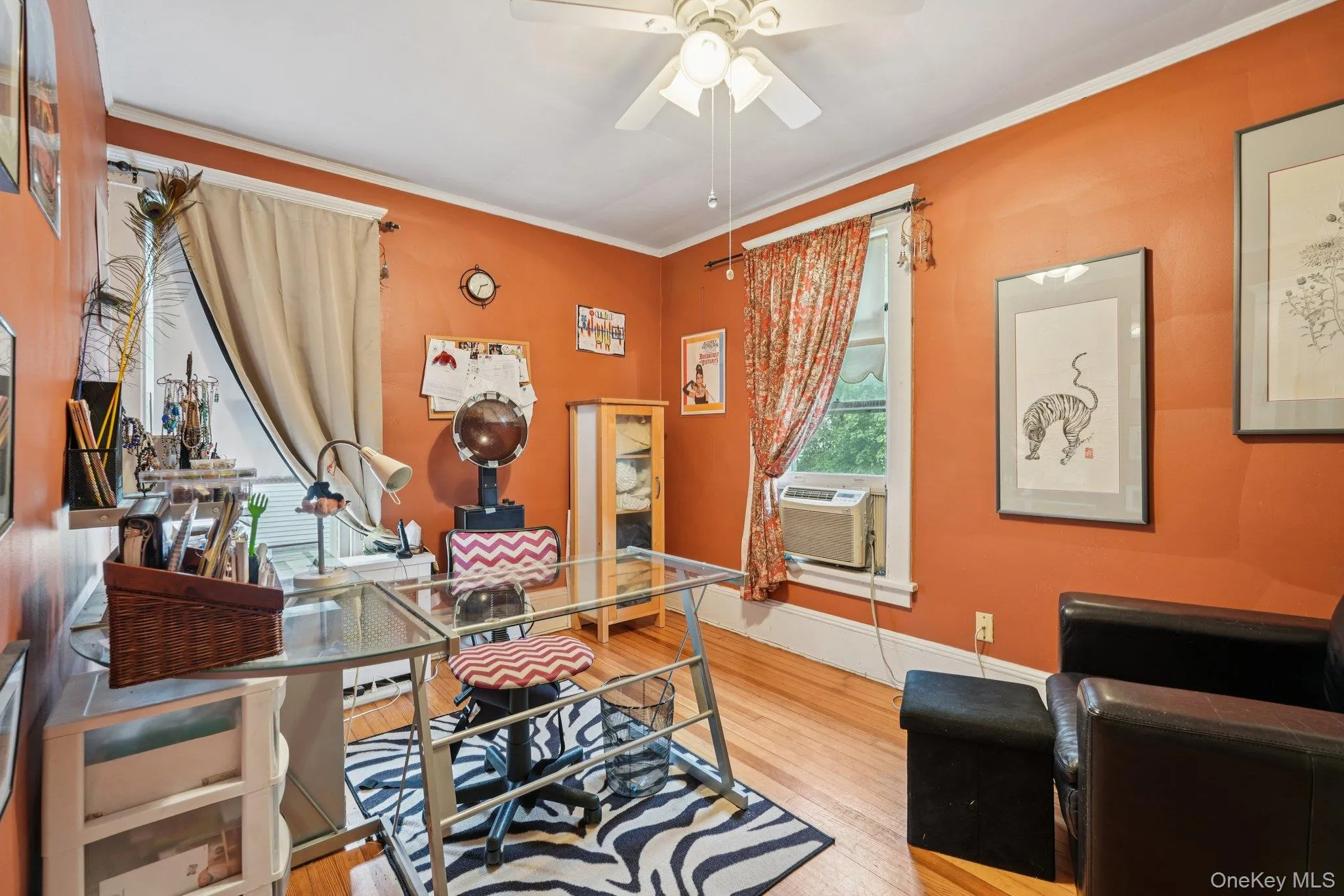 Office with ornamental molding, wood finished floors, and ceiling fan Office with ornamental molding, wood finished floors, and ceiling fan