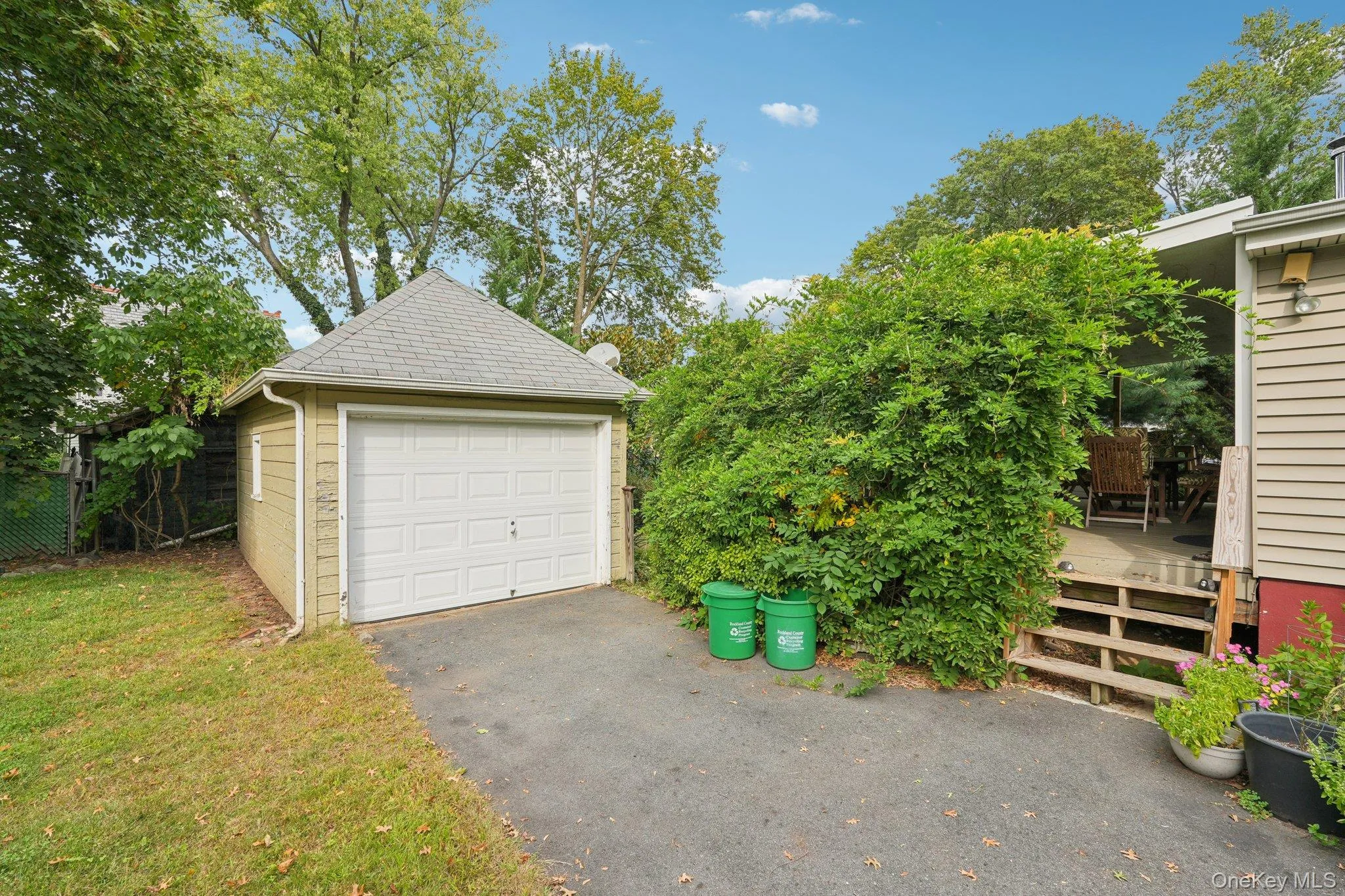 Detached garage with asphalt driveway Detached garage with asphalt driveway