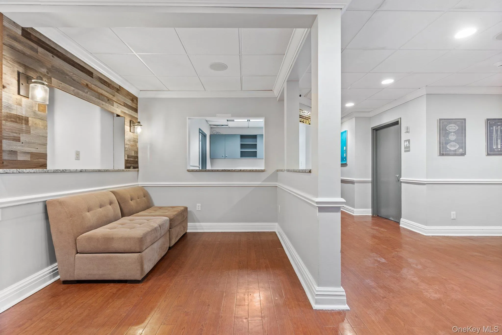 Sitting room featuring hardwood / wood-style floors, ornamental molding, and recessed lighting Sitting room featuring hardwood / wood-style floors, ornamental molding, and recessed lighting