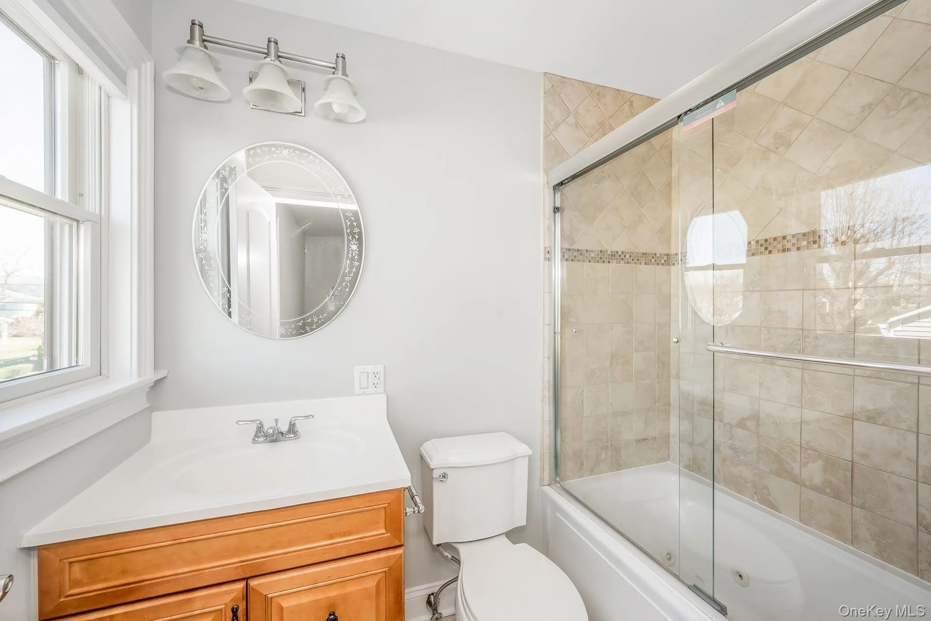 Full bath with enclosed tub / shower combo and vanity Full bath with enclosed tub / shower combo and vanity