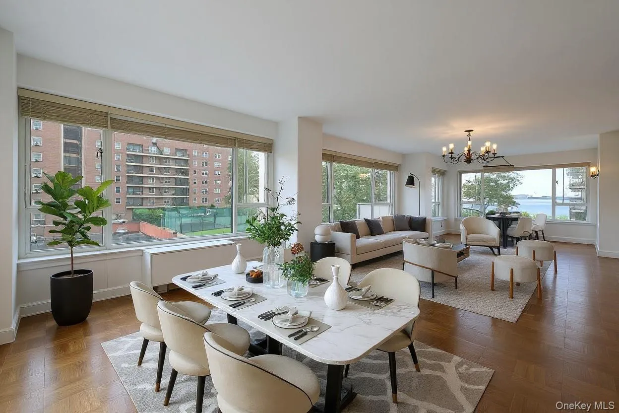 Dining room featuring a chandelier and baseboards Dining room featuring a chandelier and baseboards
