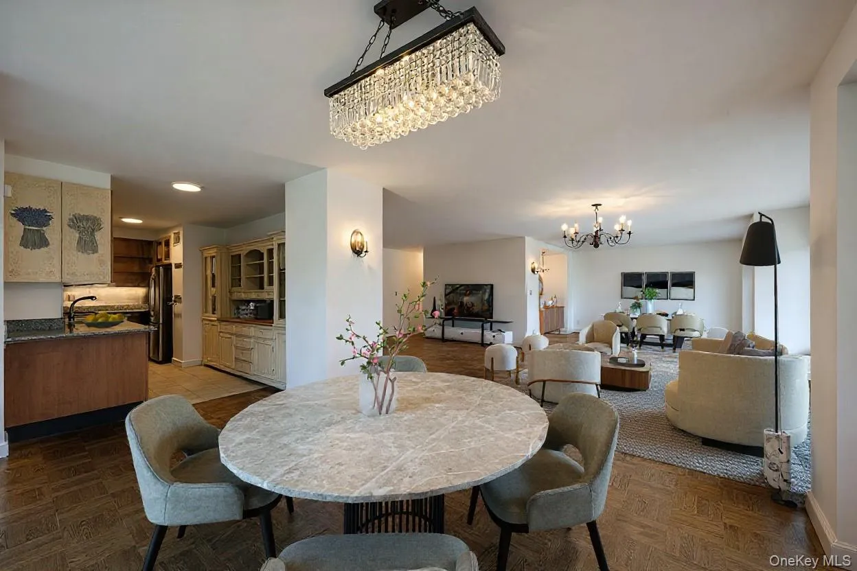 Dining space with a chandelier and recessed lighting Dining space with a chandelier and recessed lighting