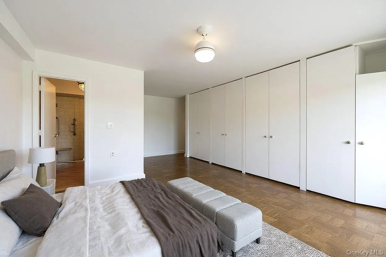 Bedroom with two closets and baseboards Bedroom with two closets and baseboards