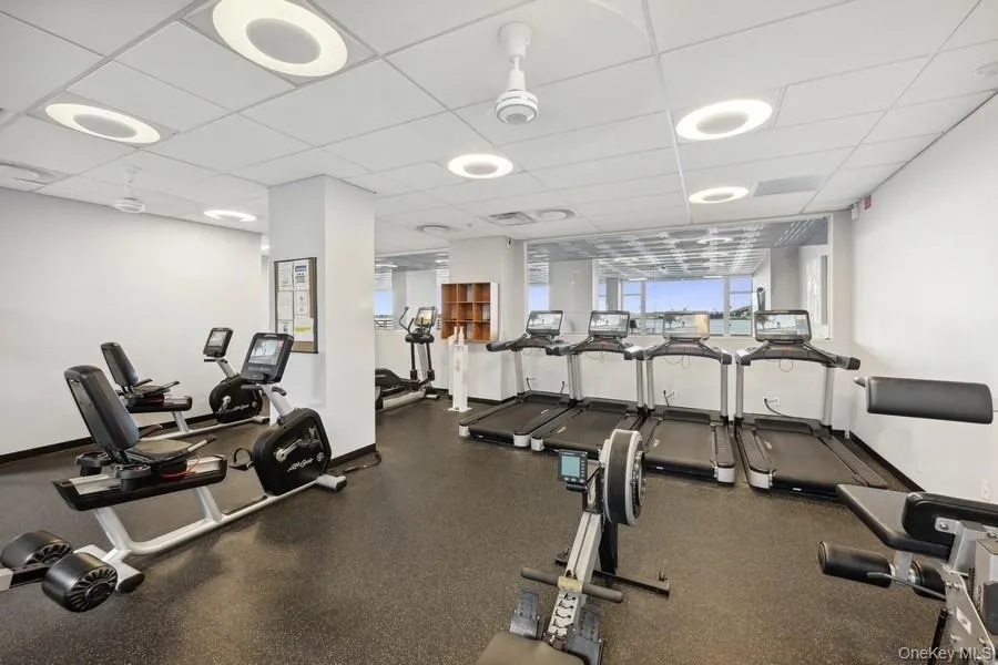 Workout area featuring a drop ceiling Workout area featuring a drop ceiling
