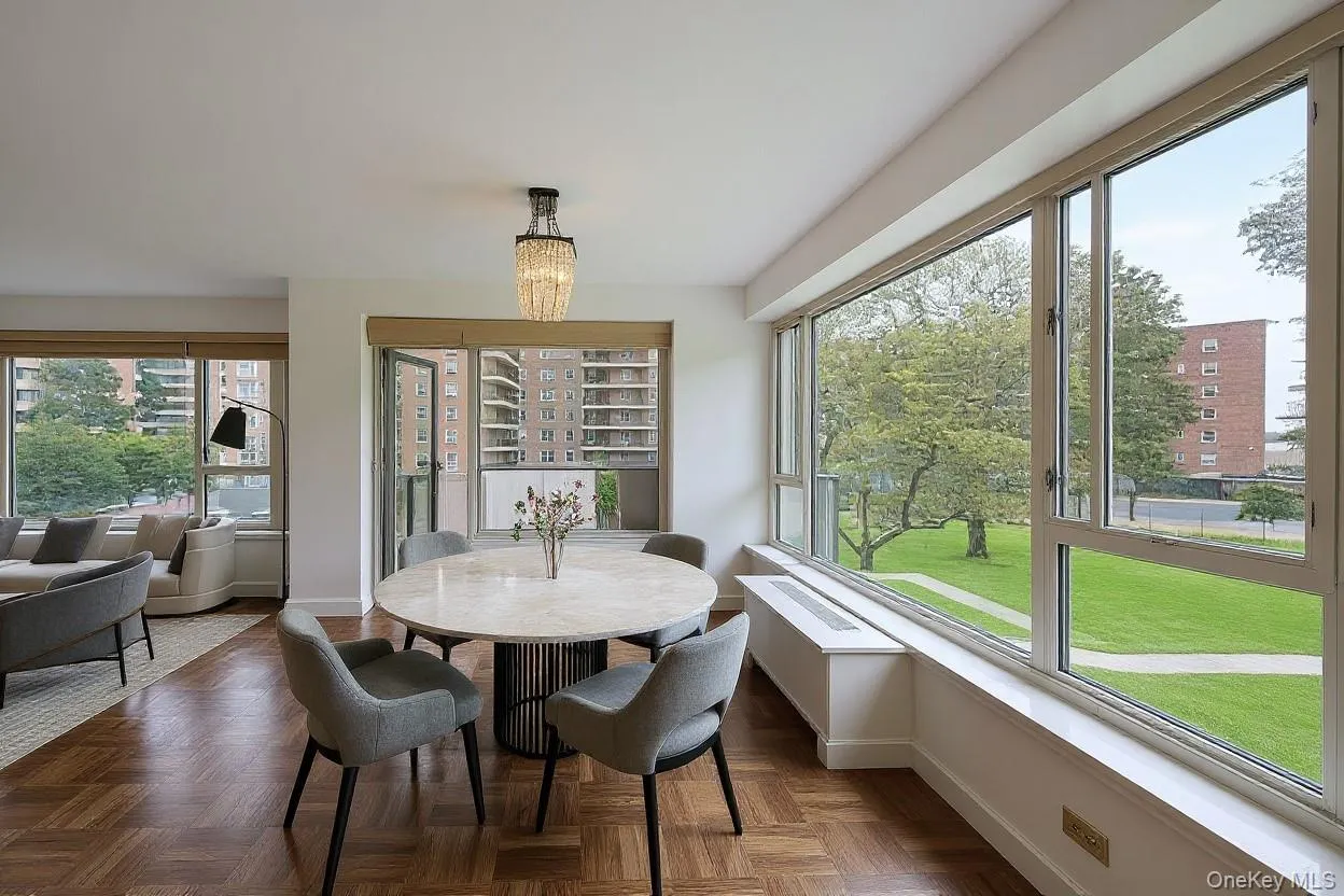 Dining space with a chandelier and healthy amount of natural light Dining space with a chandelier and healthy amount of natural light