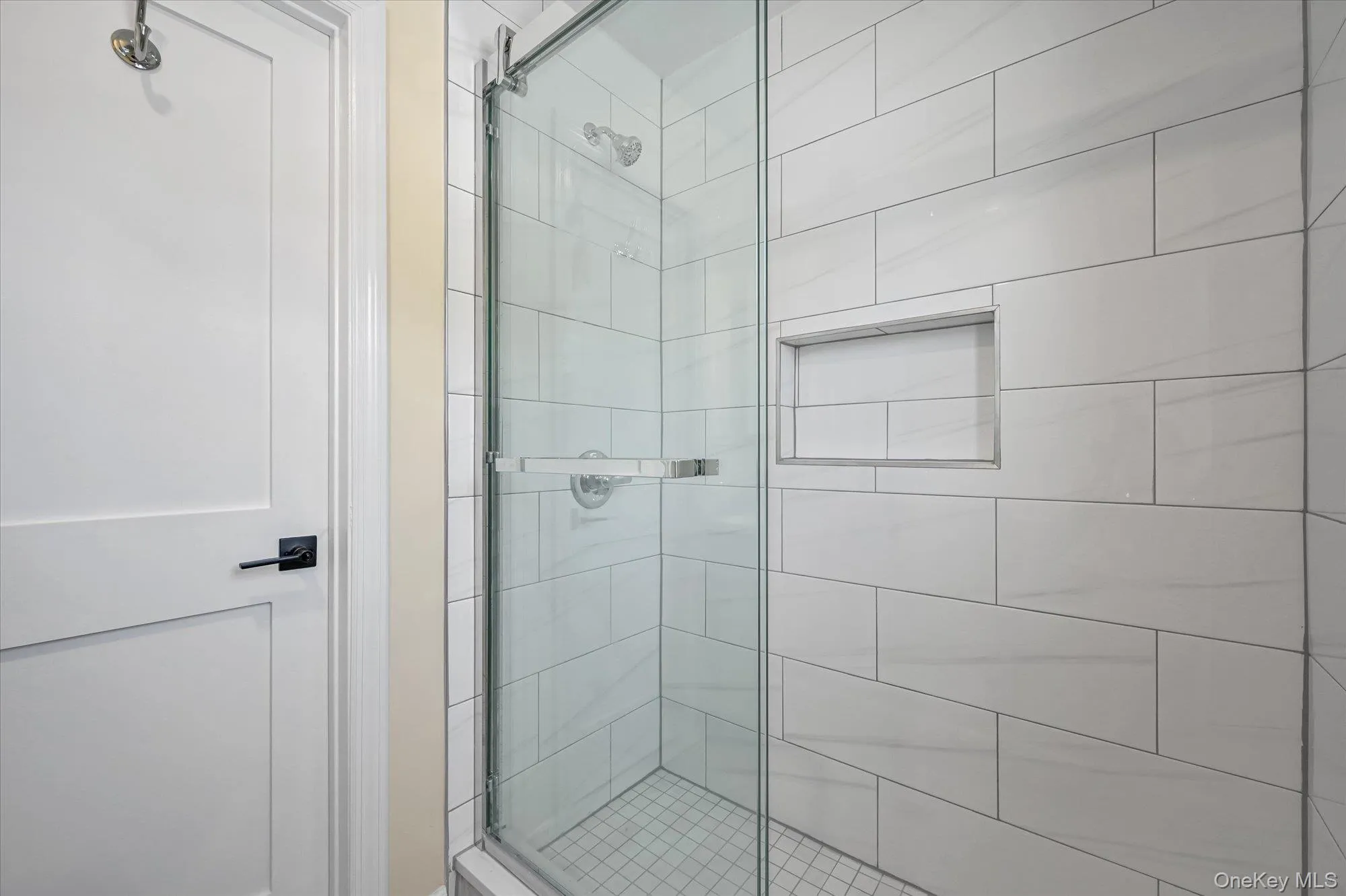 Full bathroom with a shower stall Full bathroom with a shower stall