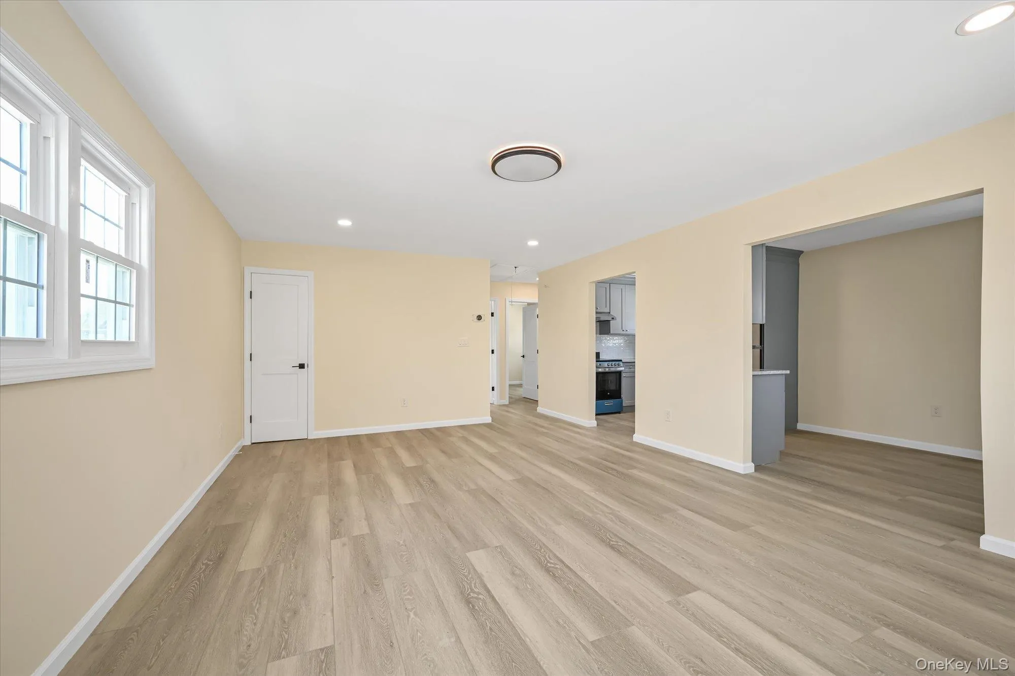 Unfurnished living room with recessed lighting and light wood-style flooring Unfurnished living room with recessed lighting and light wood-style flooring