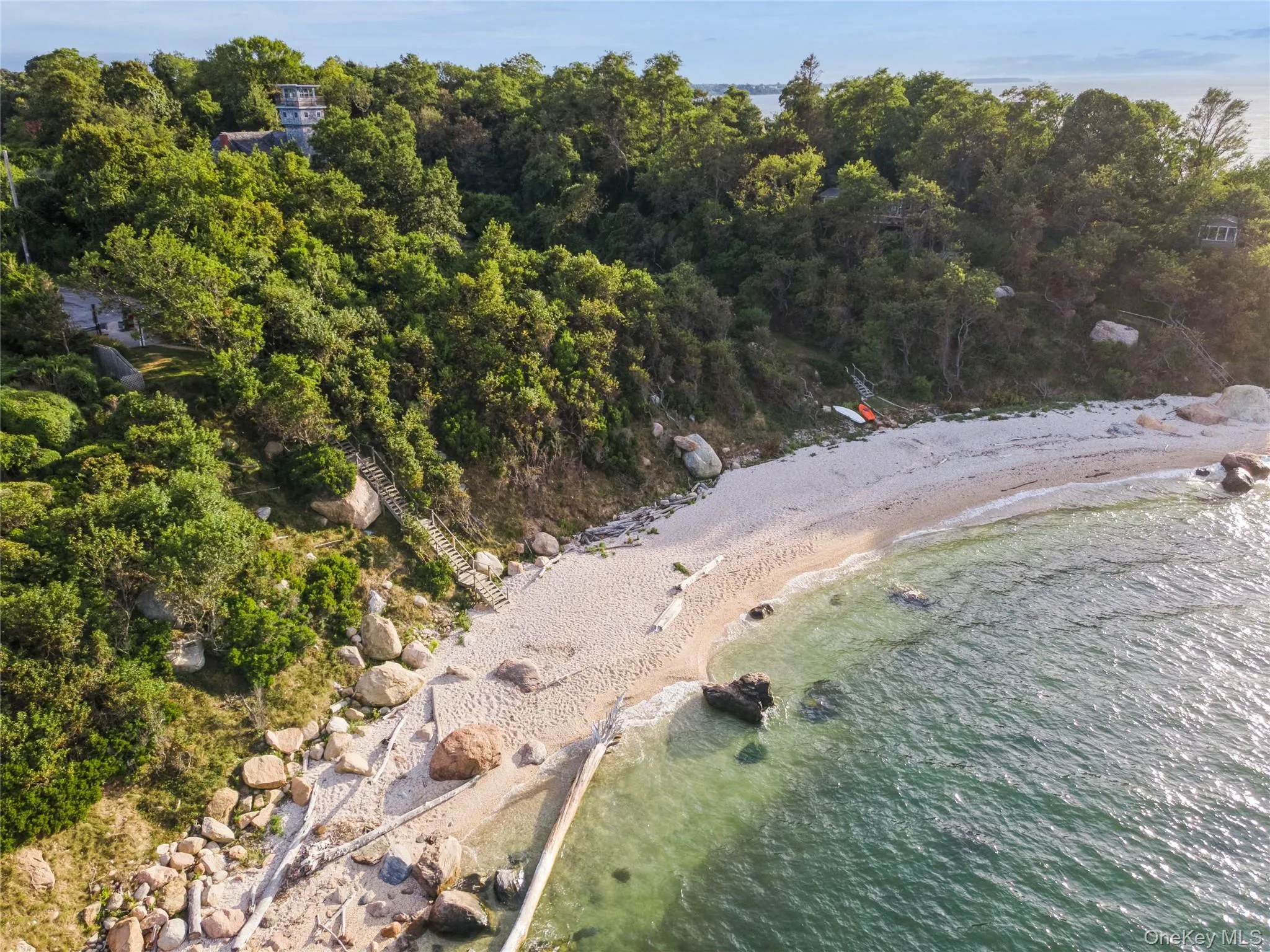 Aerial view of property's location featuring a large body of water Aerial view of property's location featuring a large body of water