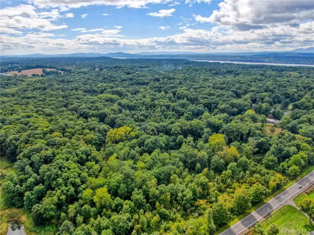 Aerial view featuring a mountain view Aerial view featuring a mountain view