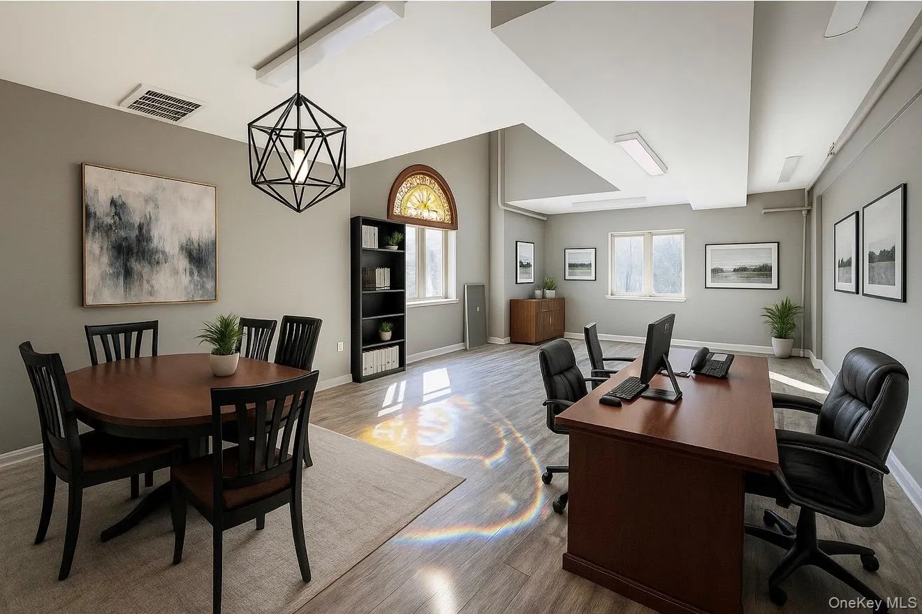 *Enhanced* Office space featuring plenty of natural light and wood finished floors *Enhanced* Office space featuring plenty of natural light and wood finished floors