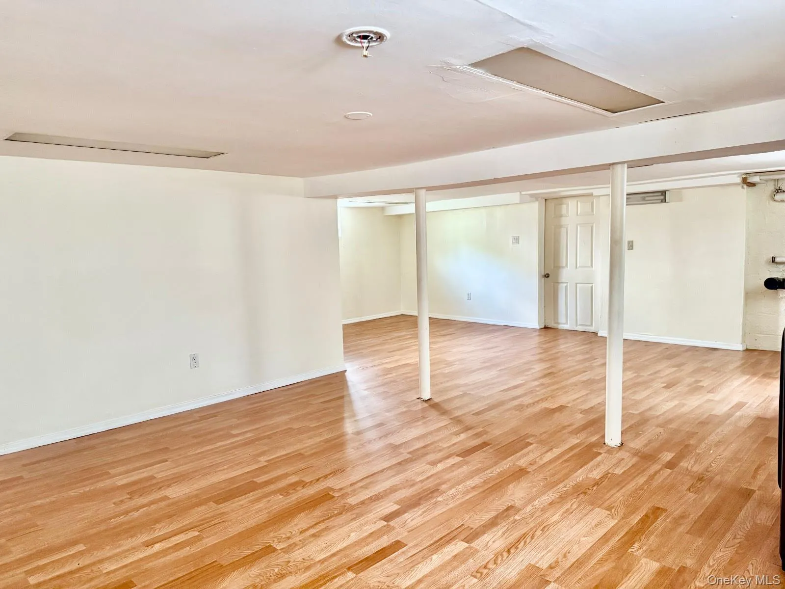 Finished basement featuring light wood-type flooring Finished basement featuring light wood-type flooring
