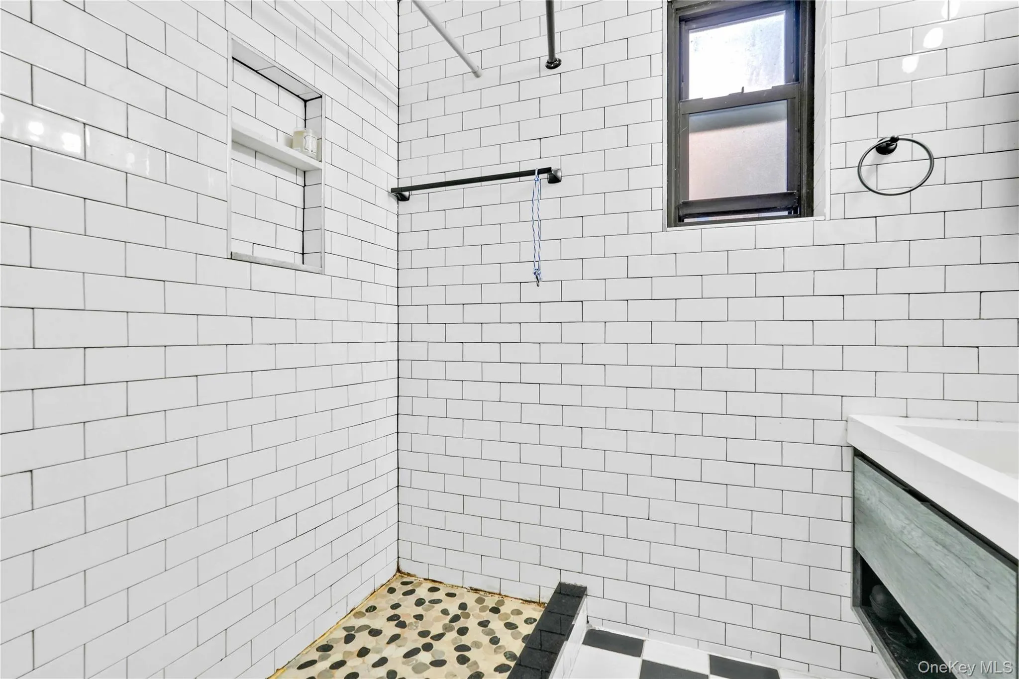 Full bath featuring vanity and a stall shower Full bath featuring vanity and a stall shower