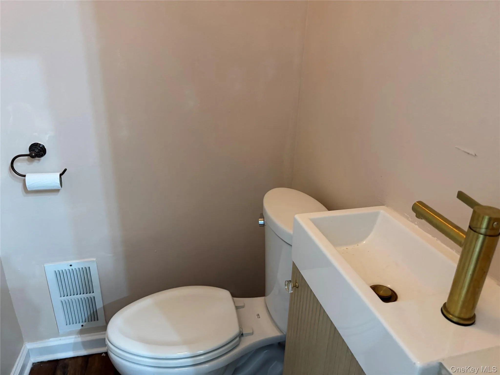 Bathroom featuring vanity and toilet Bathroom featuring vanity and toilet