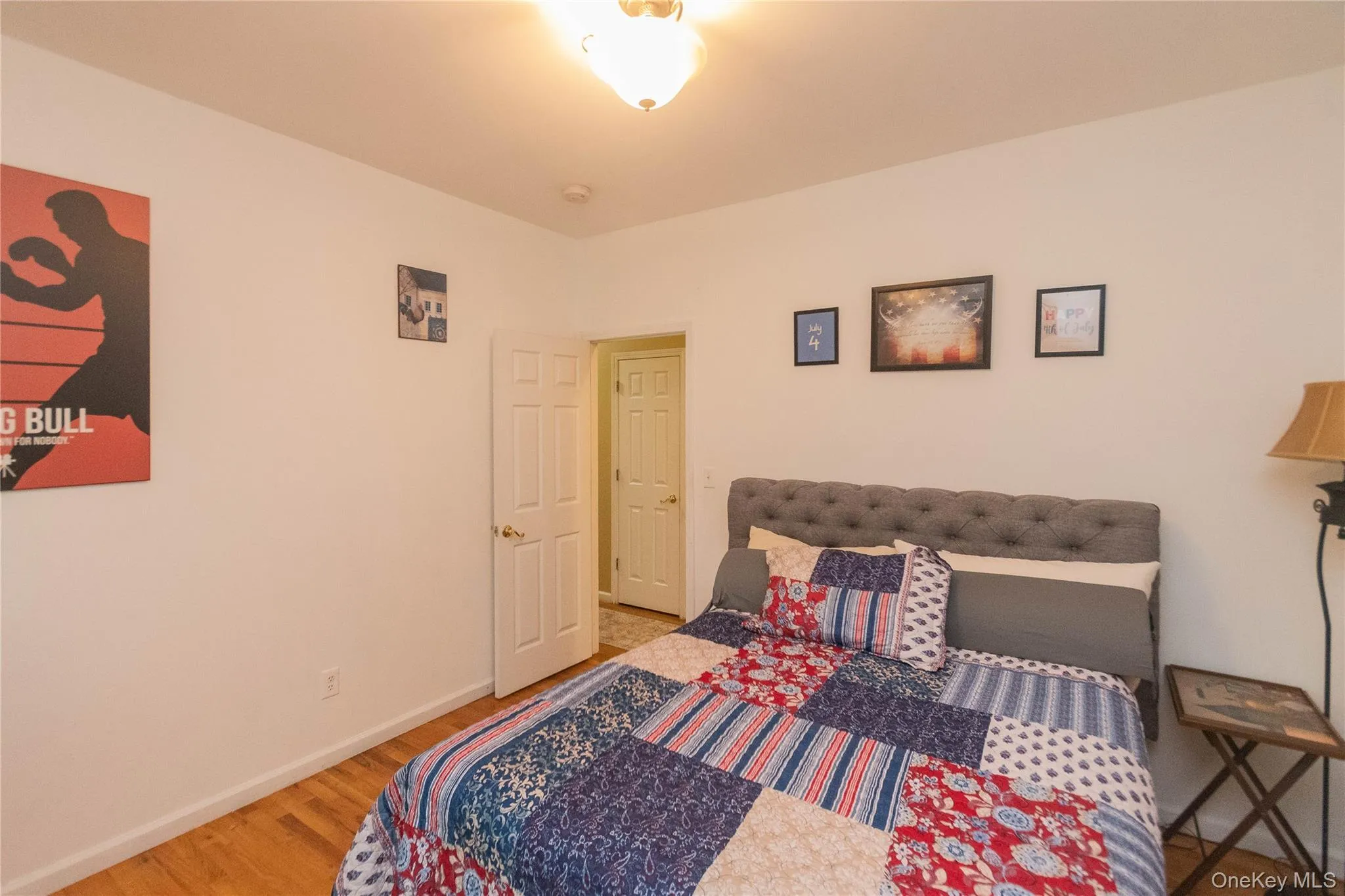 Bedroom with light wood-style floors and baseboards Bedroom with light wood-style floors and baseboards