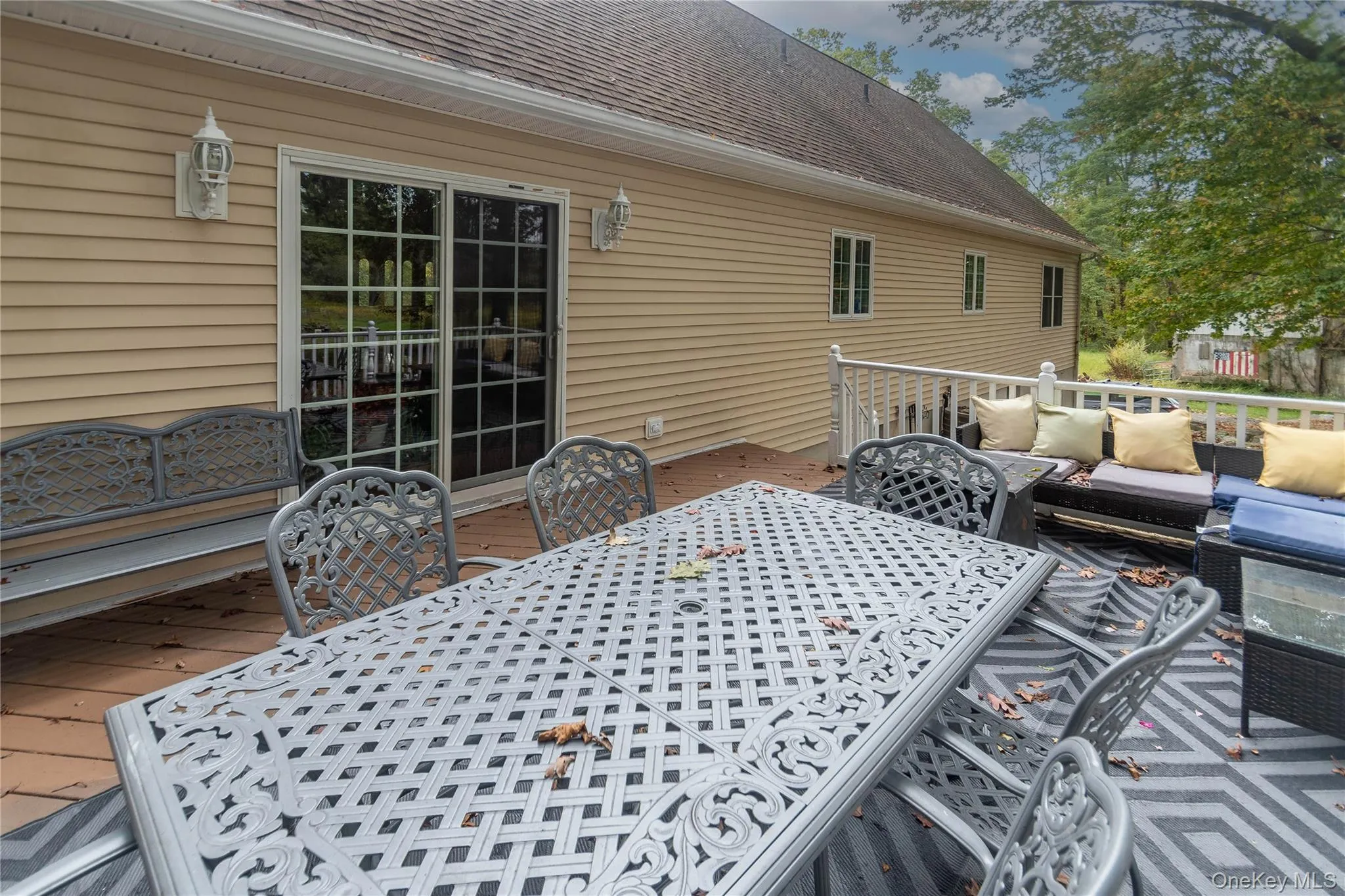 Wooden terrace featuring outdoor lounge area and outdoor dining space Wooden terrace featuring outdoor lounge area and outdoor dining space