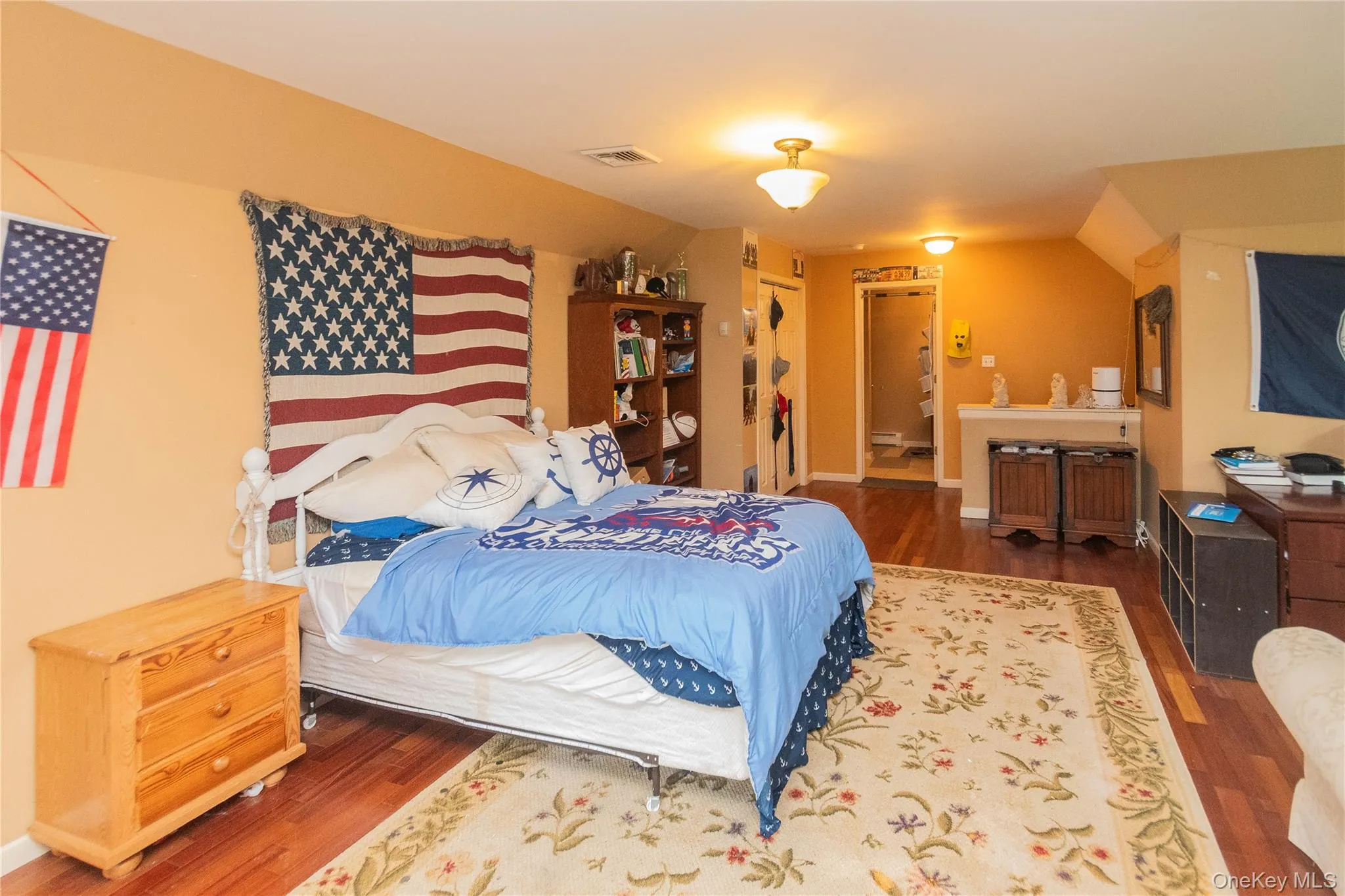 Bedroom featuring wood finished floors Bedroom featuring wood finished floors