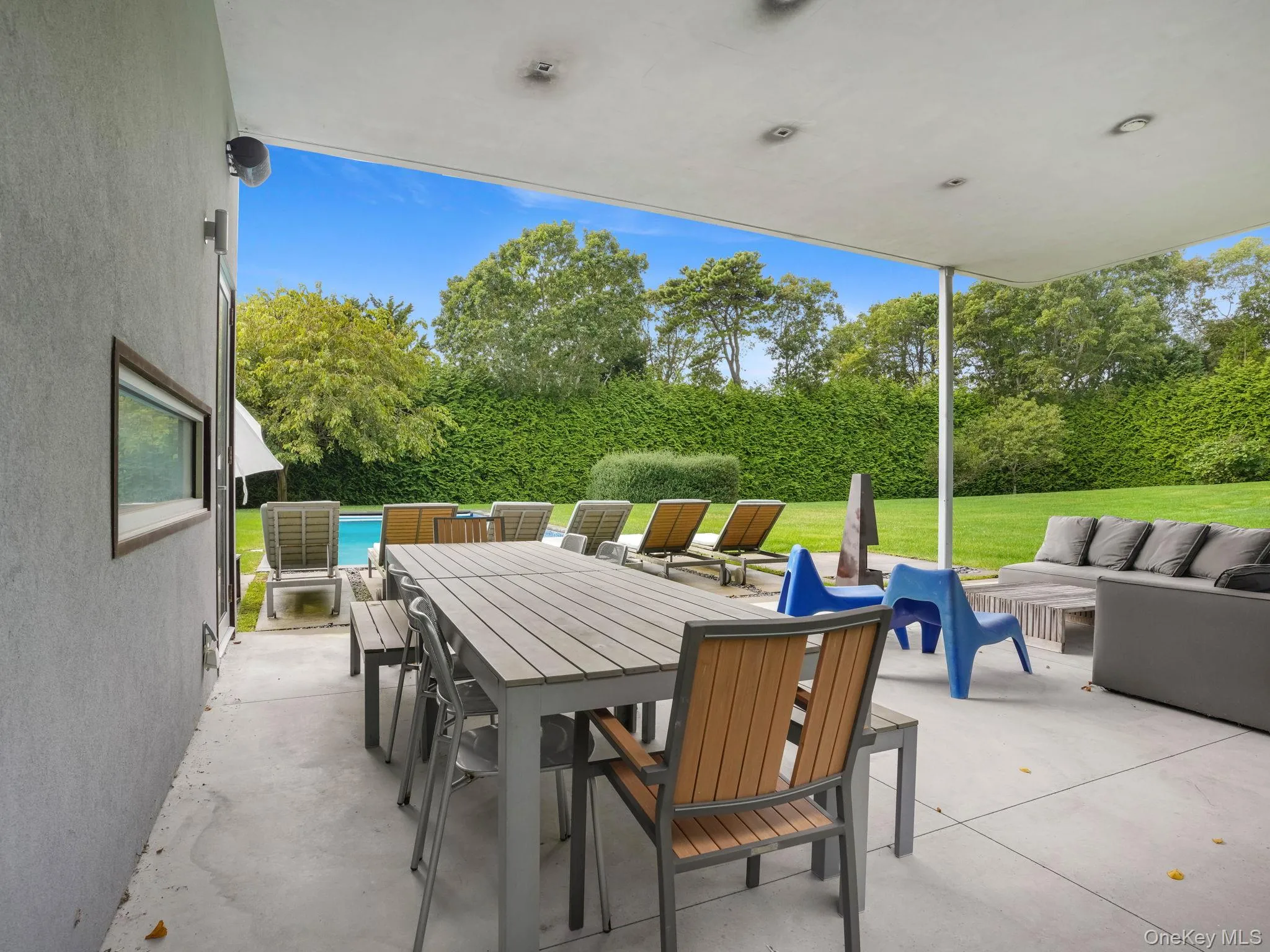 View of patio with an outdoor living space, outdoor dining space, and an outdoor pool View of patio with an outdoor living space, outdoor dining space, and an outdoor pool
