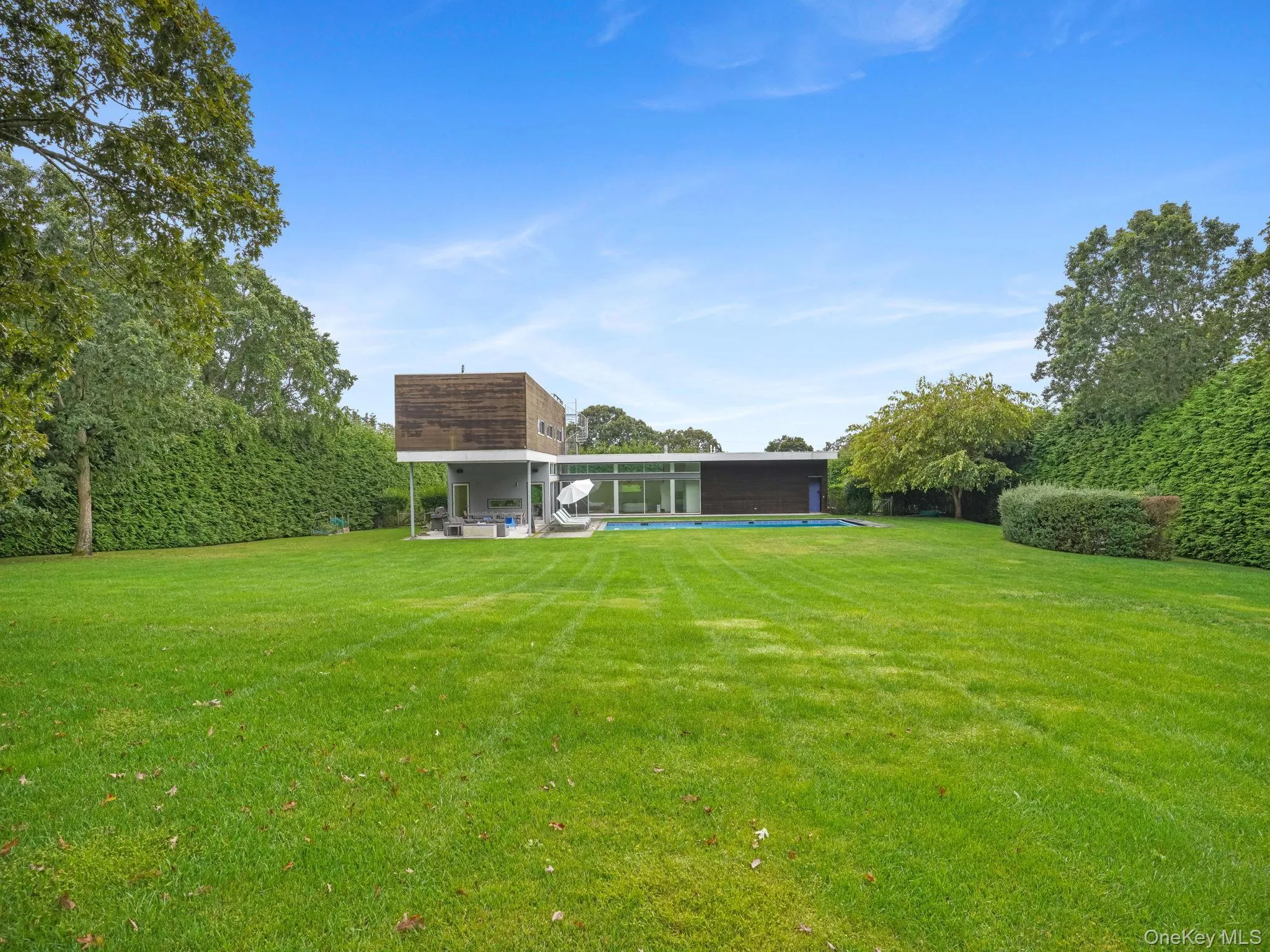 View of grassy yard with a patio View of grassy yard with a patio