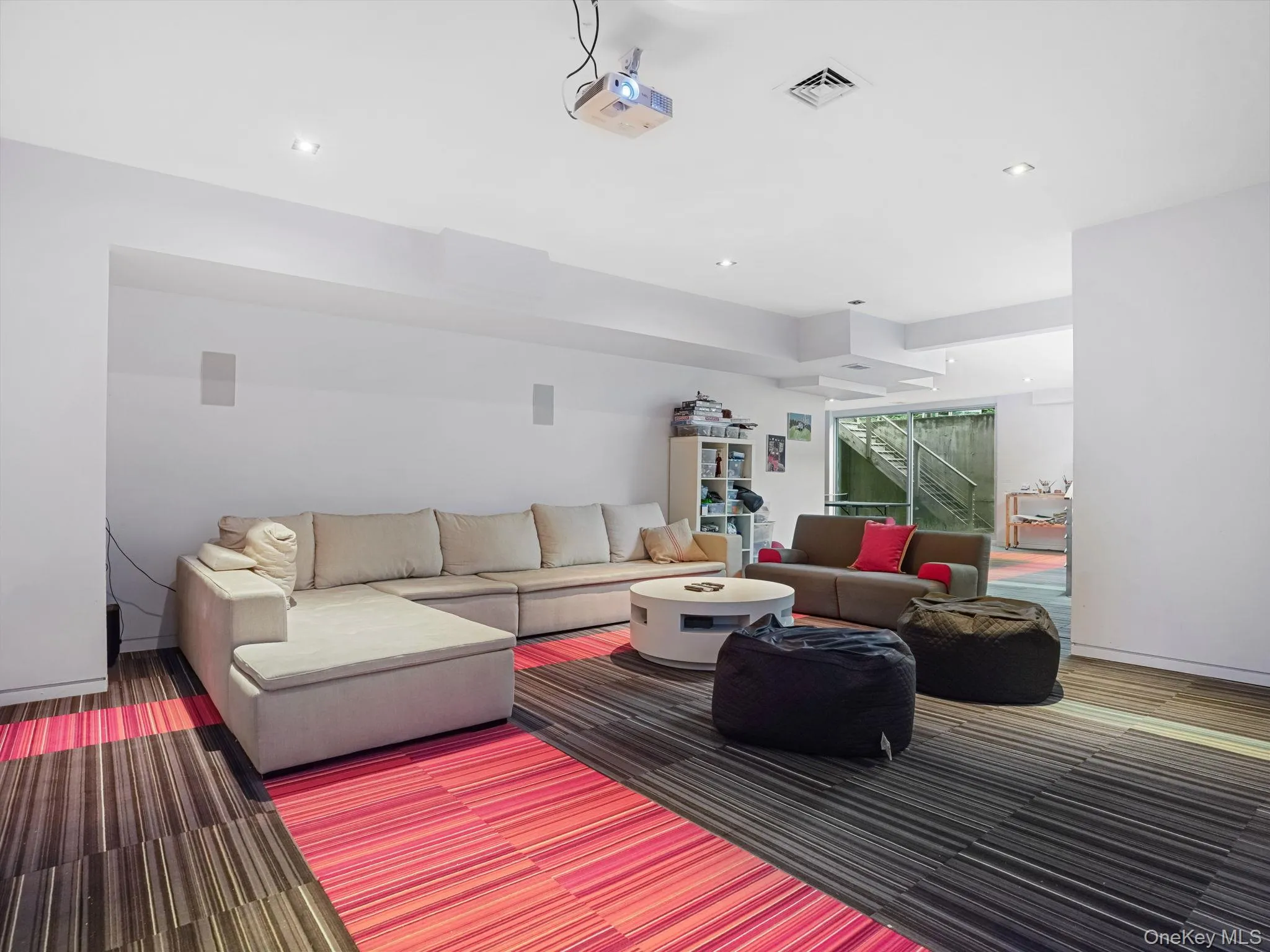 Carpeted living room featuring recessed lighting Carpeted living room featuring recessed lighting