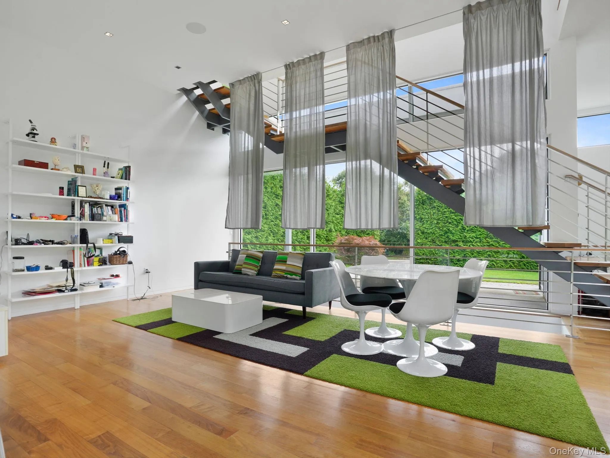 Building lobby with a wall of windows and a towering ceiling Building lobby with a wall of windows and a towering ceiling