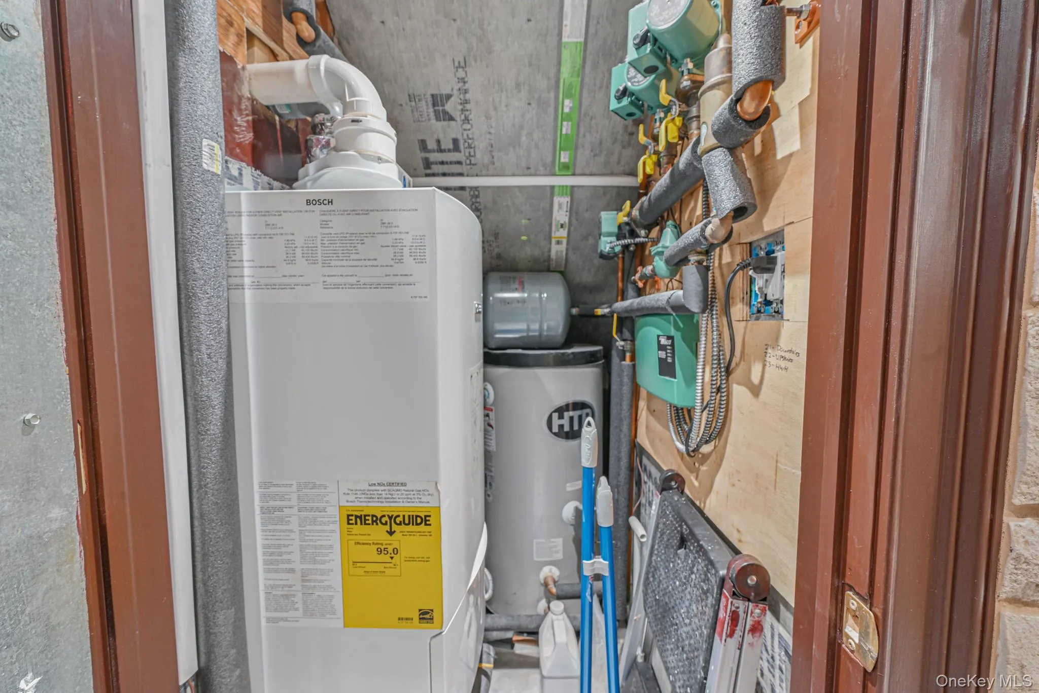 Utility room with water heater Utility room with water heater