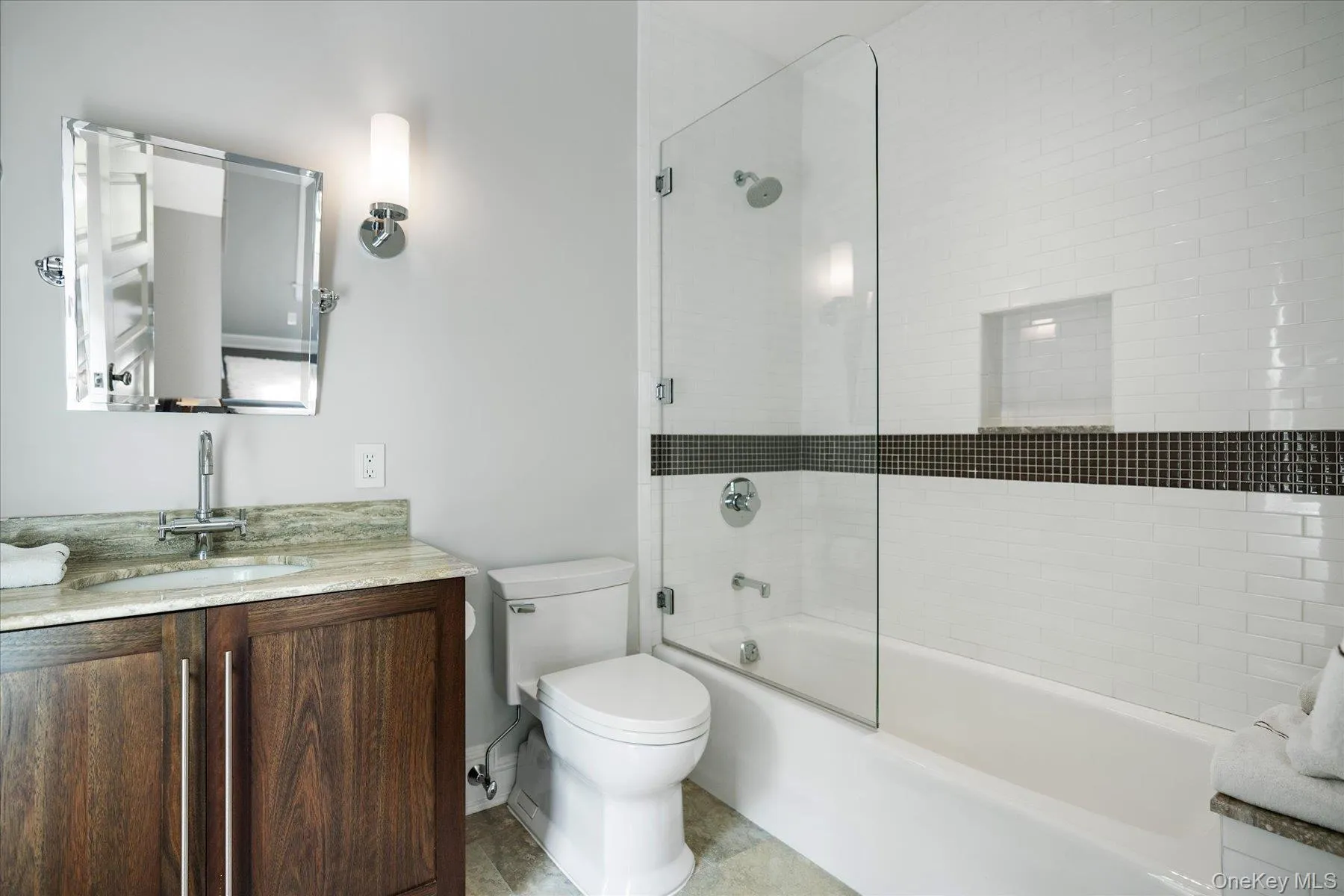 Bathroom with vanity and bath / shower combo with glass door Bathroom with vanity and bath / shower combo with glass door