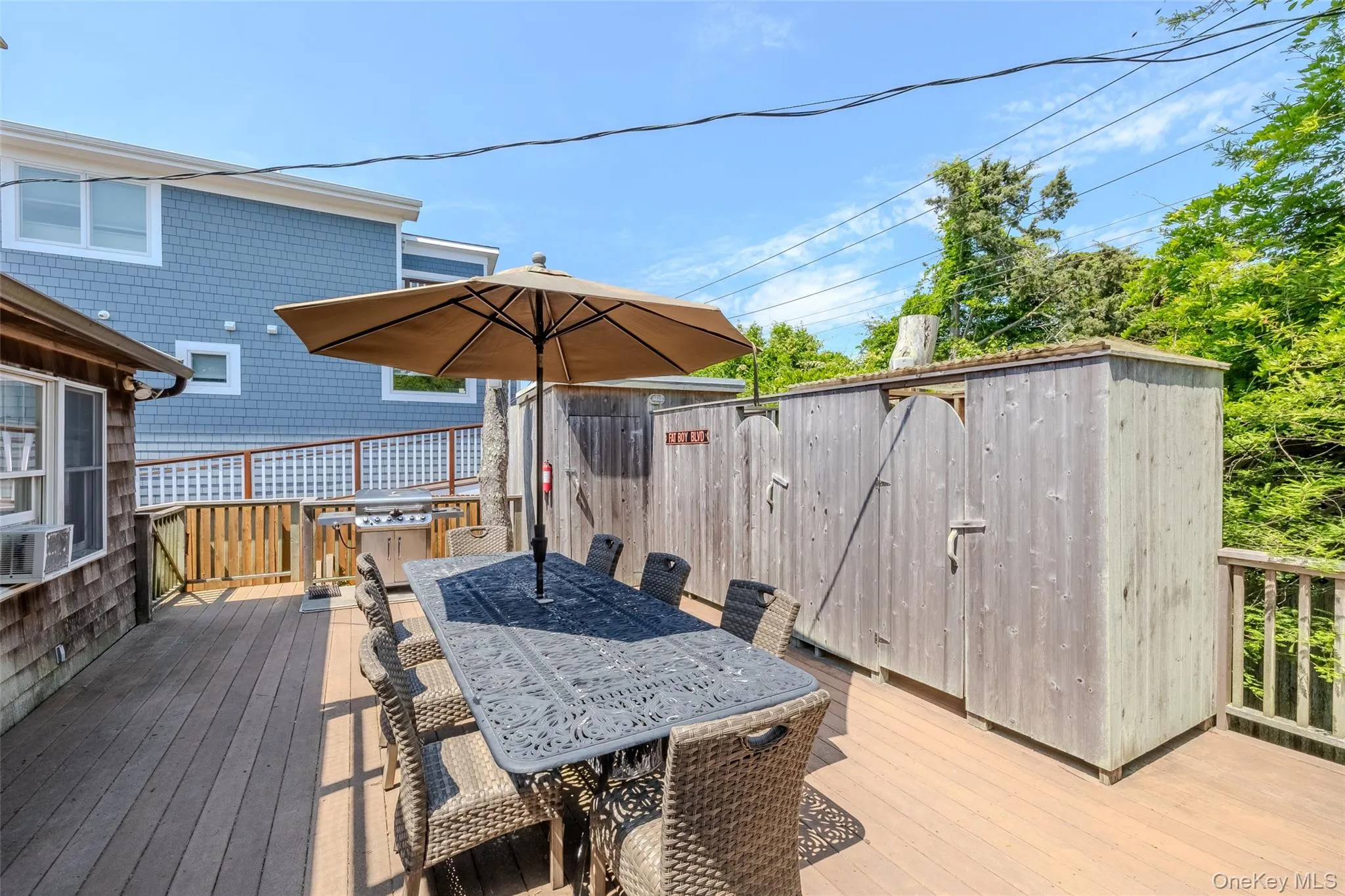 Wooden terrace with outdoor dining space Wooden terrace with outdoor dining space