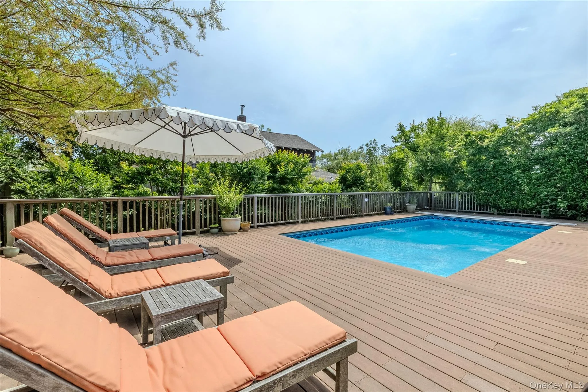 View of swimming pool featuring a deck View of swimming pool featuring a deck