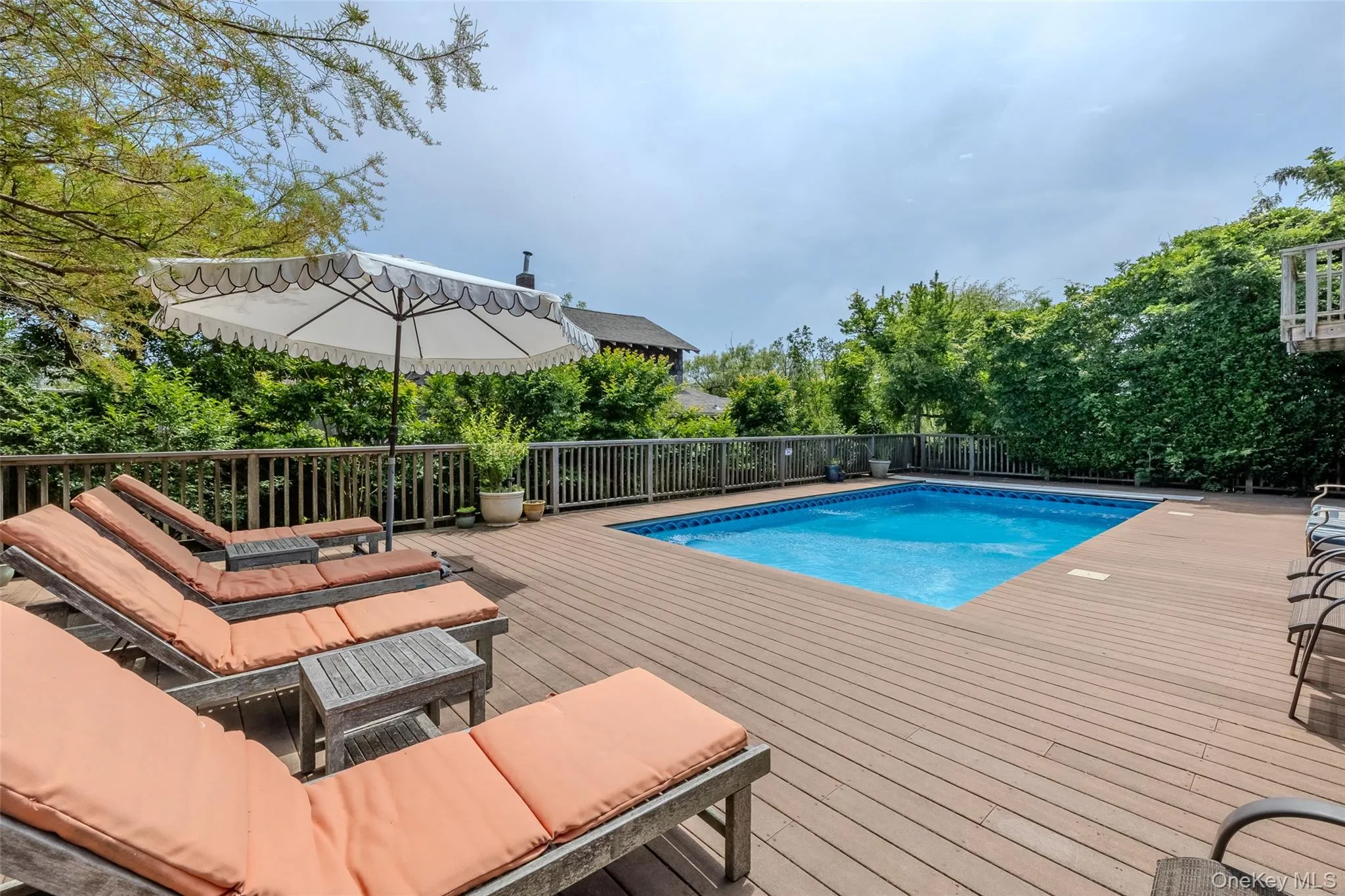 View of swimming pool with a Trex deck View of swimming pool with a Trex deck