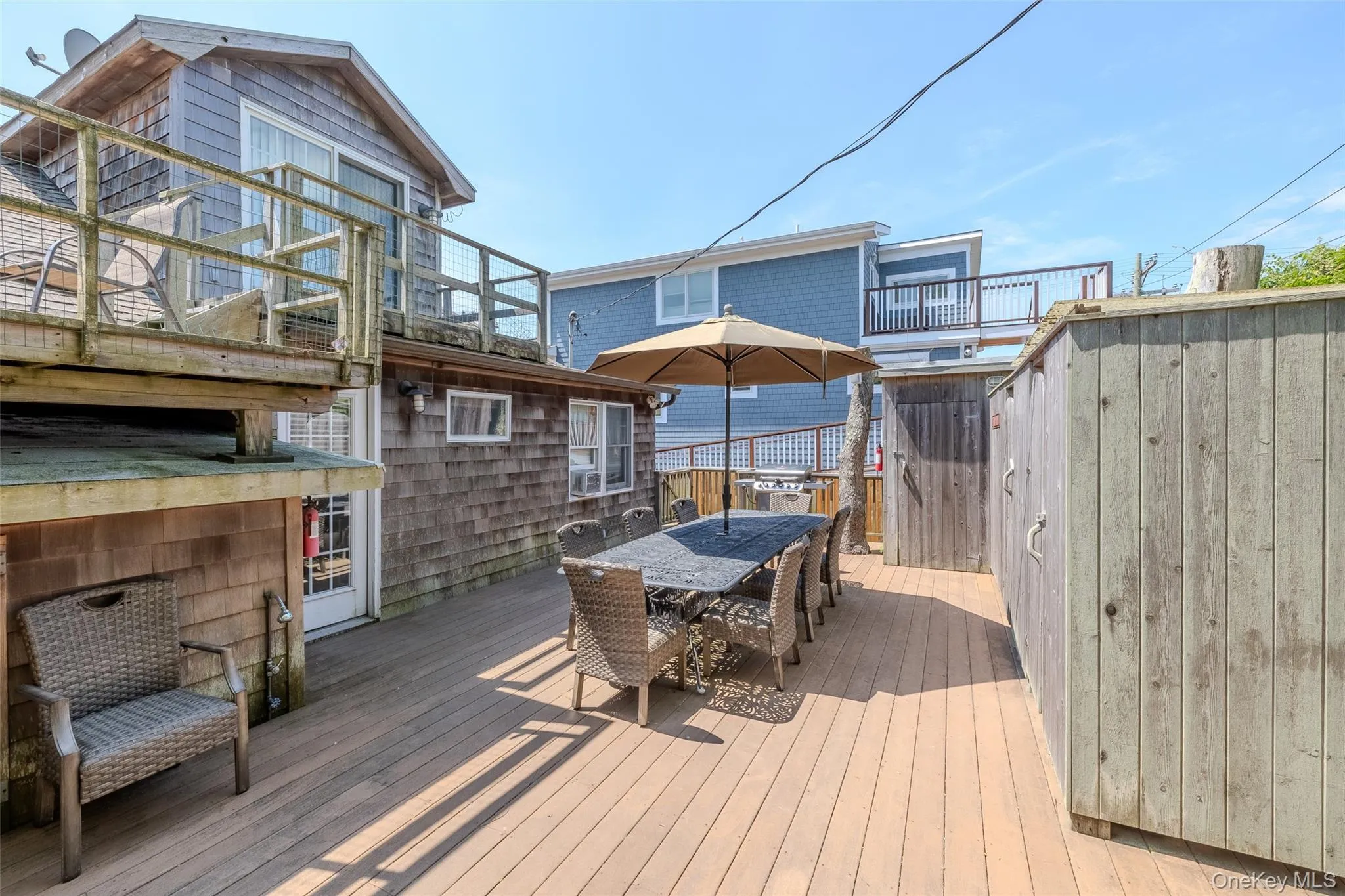 Wooden deck featuring outdoor dining area Wooden deck featuring outdoor dining area