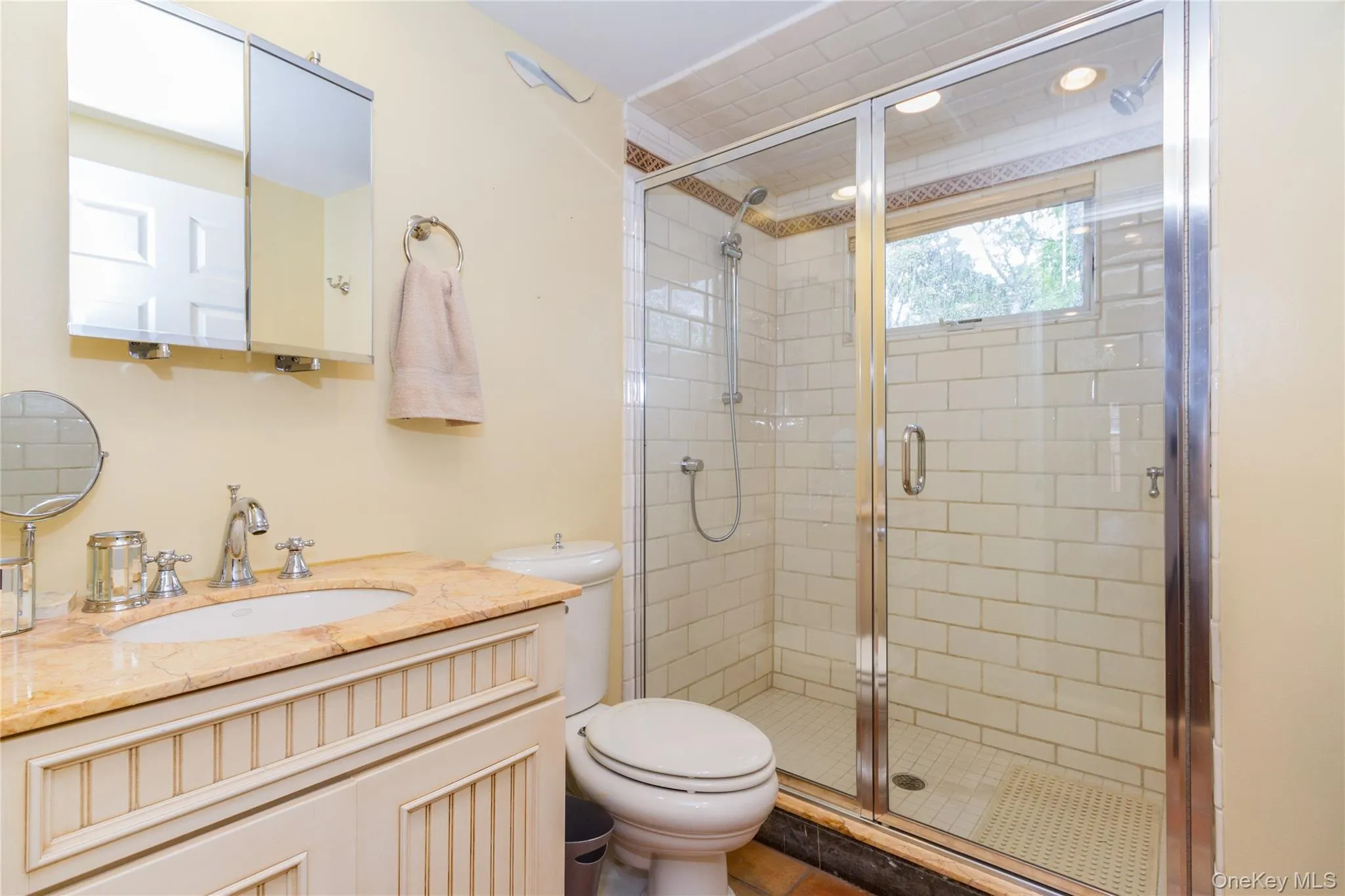 Full bath with vanity and a shower stall Full bath with vanity and a shower stall