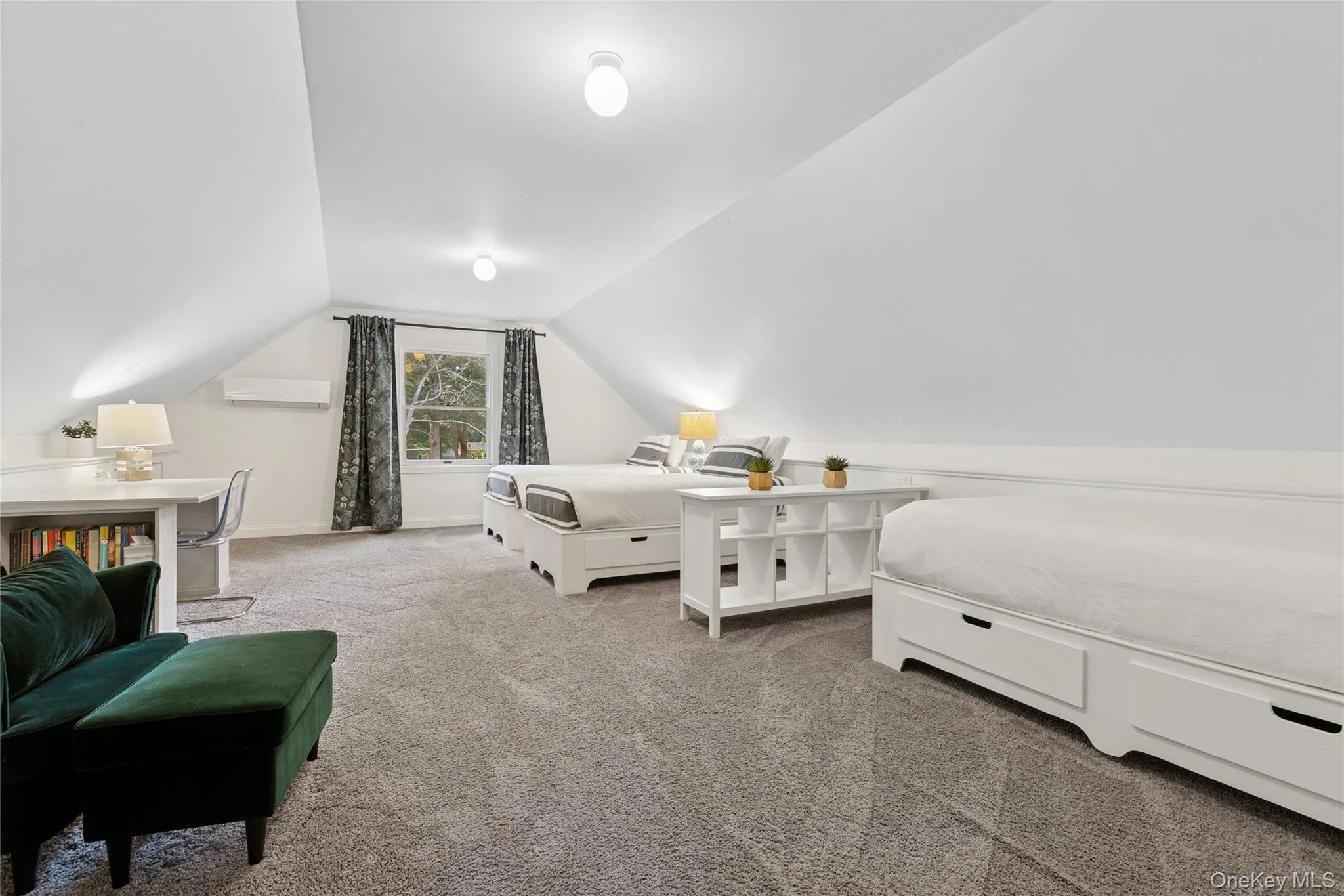 Carpeted bedroom featuring vaulted ceiling Carpeted bedroom featuring vaulted ceiling