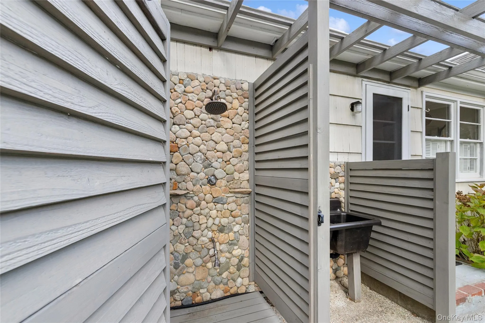 View of exterior entry with stone siding View of exterior entry with stone siding