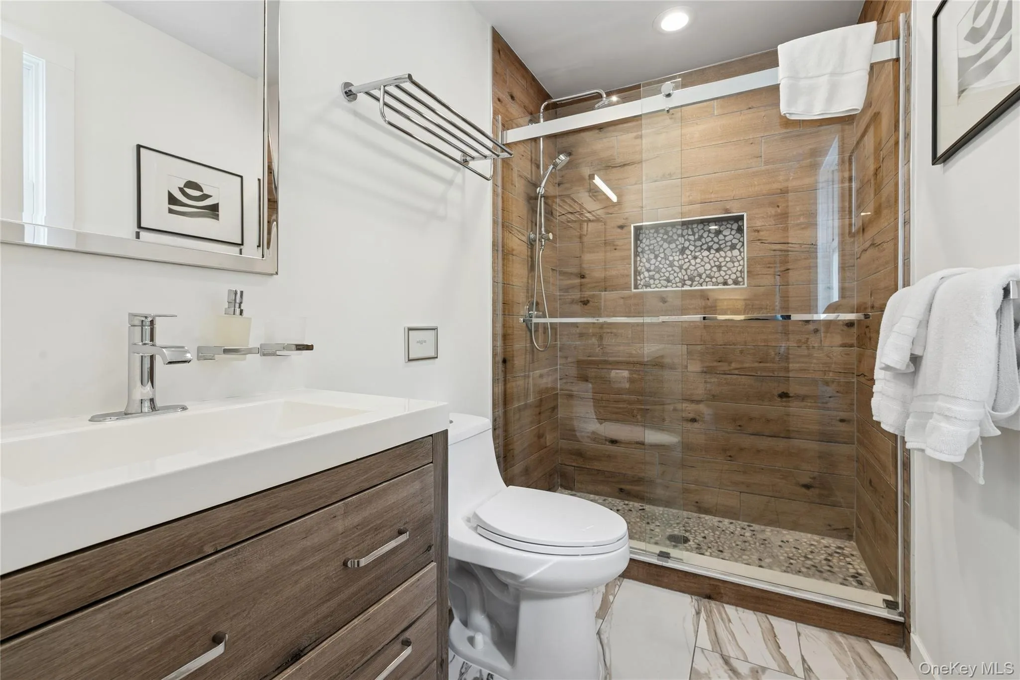 Bathroom with vanity and a stall shower Bathroom with vanity and a stall shower