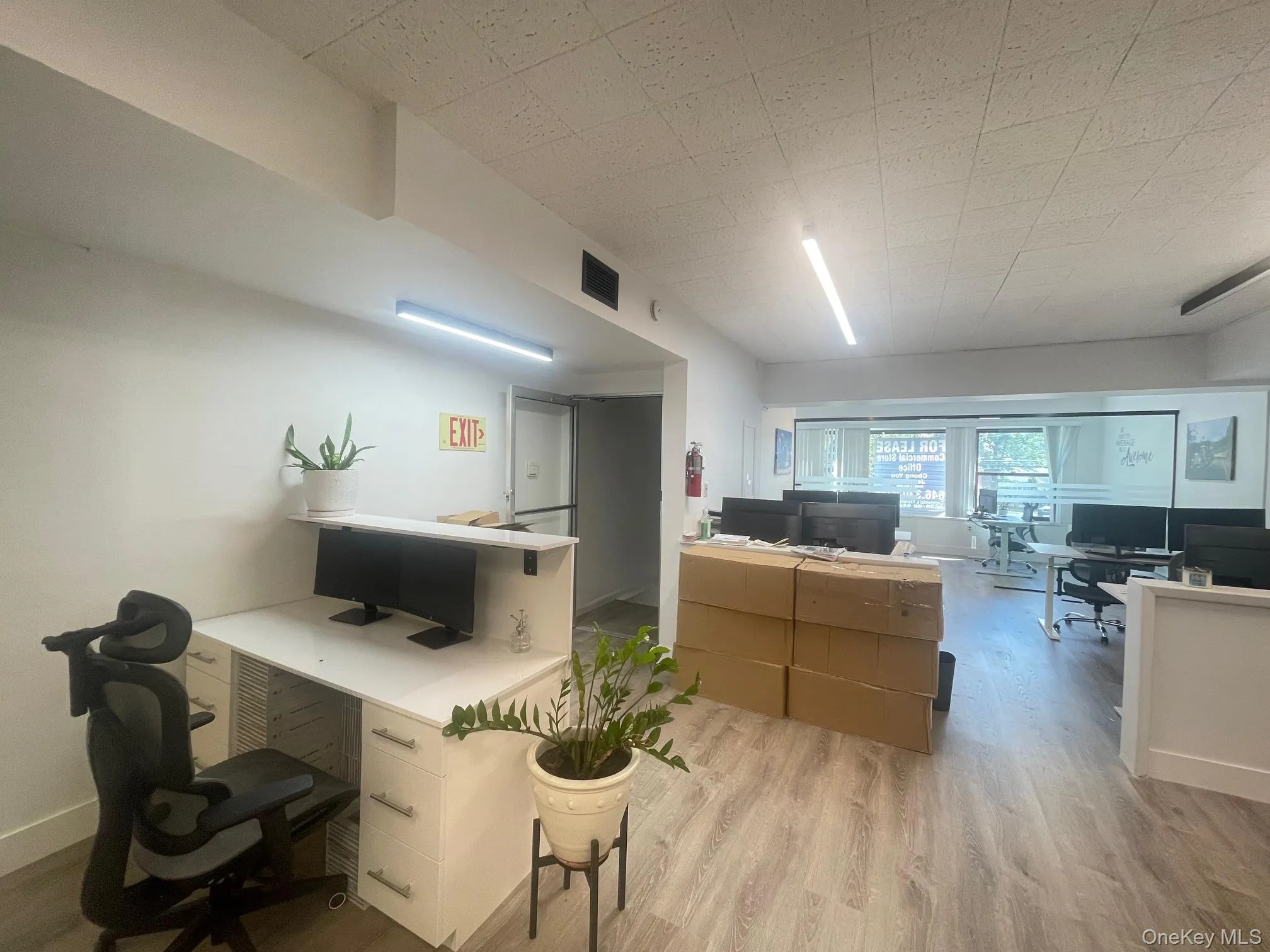 Office area with light wood-style floors Office area with light wood-style floors