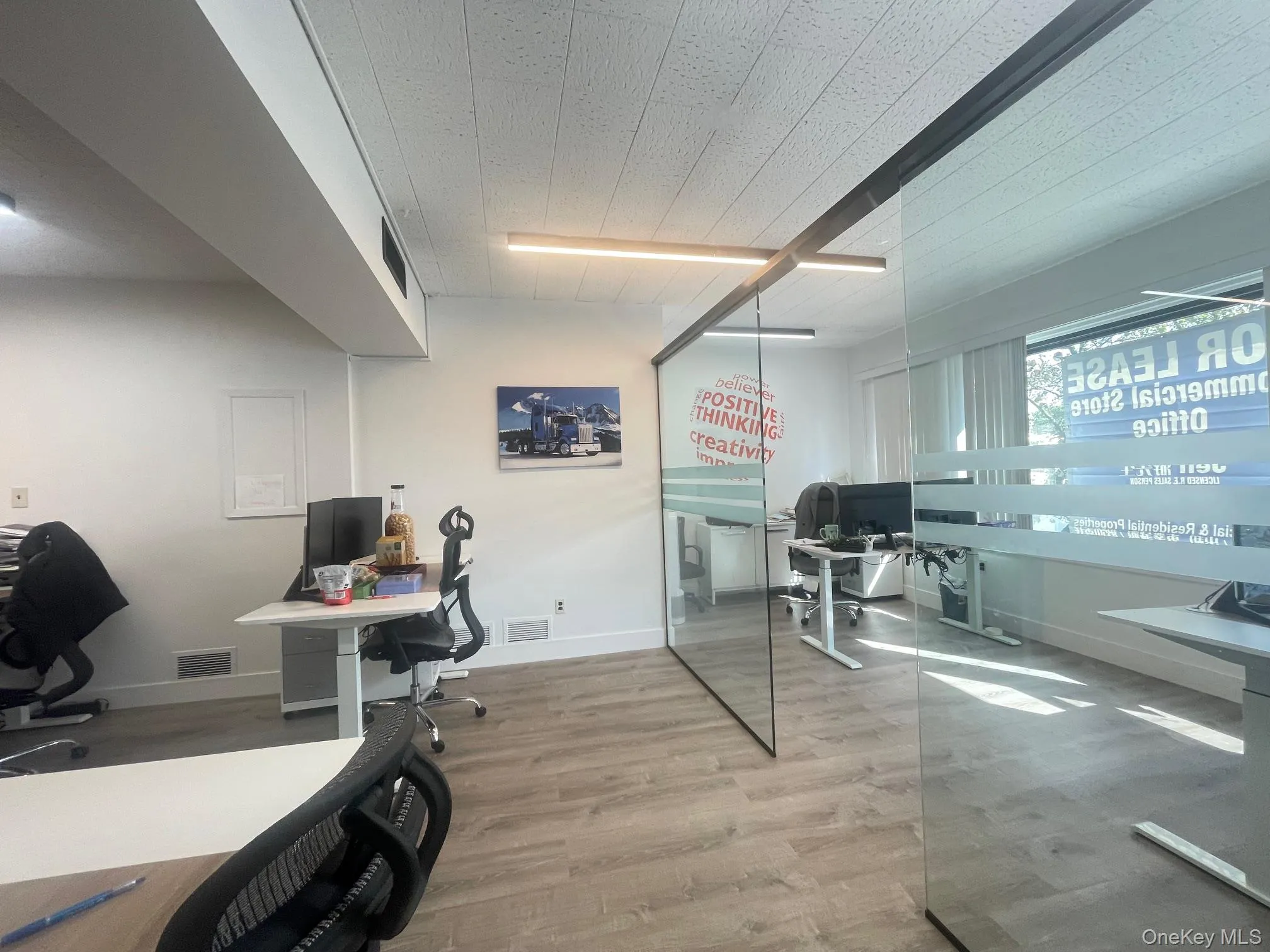 Home office featuring wood finished floors and baseboards Home office featuring wood finished floors and baseboards