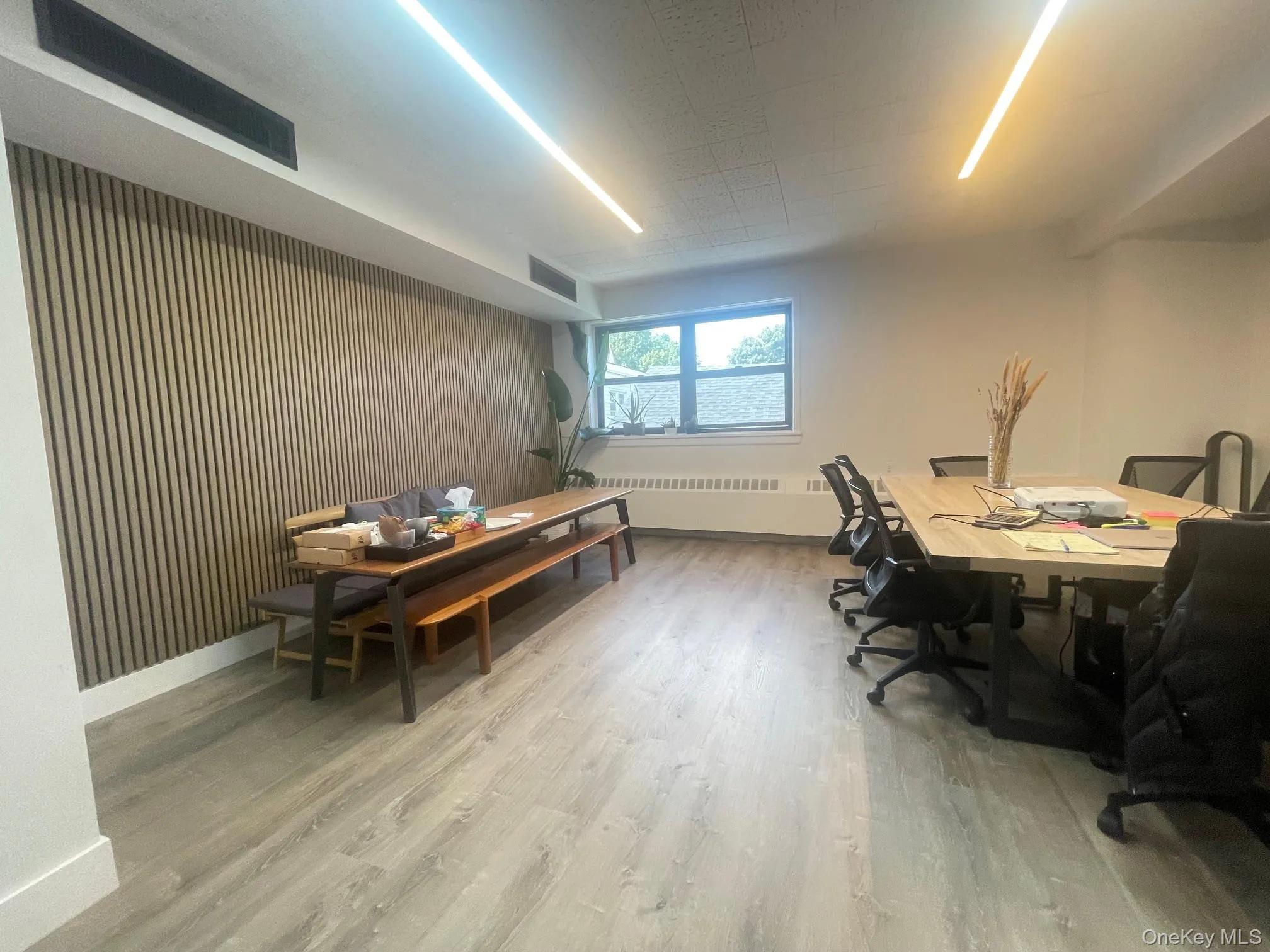 Office featuring light wood finished floors and radiator Office featuring light wood finished floors and radiator