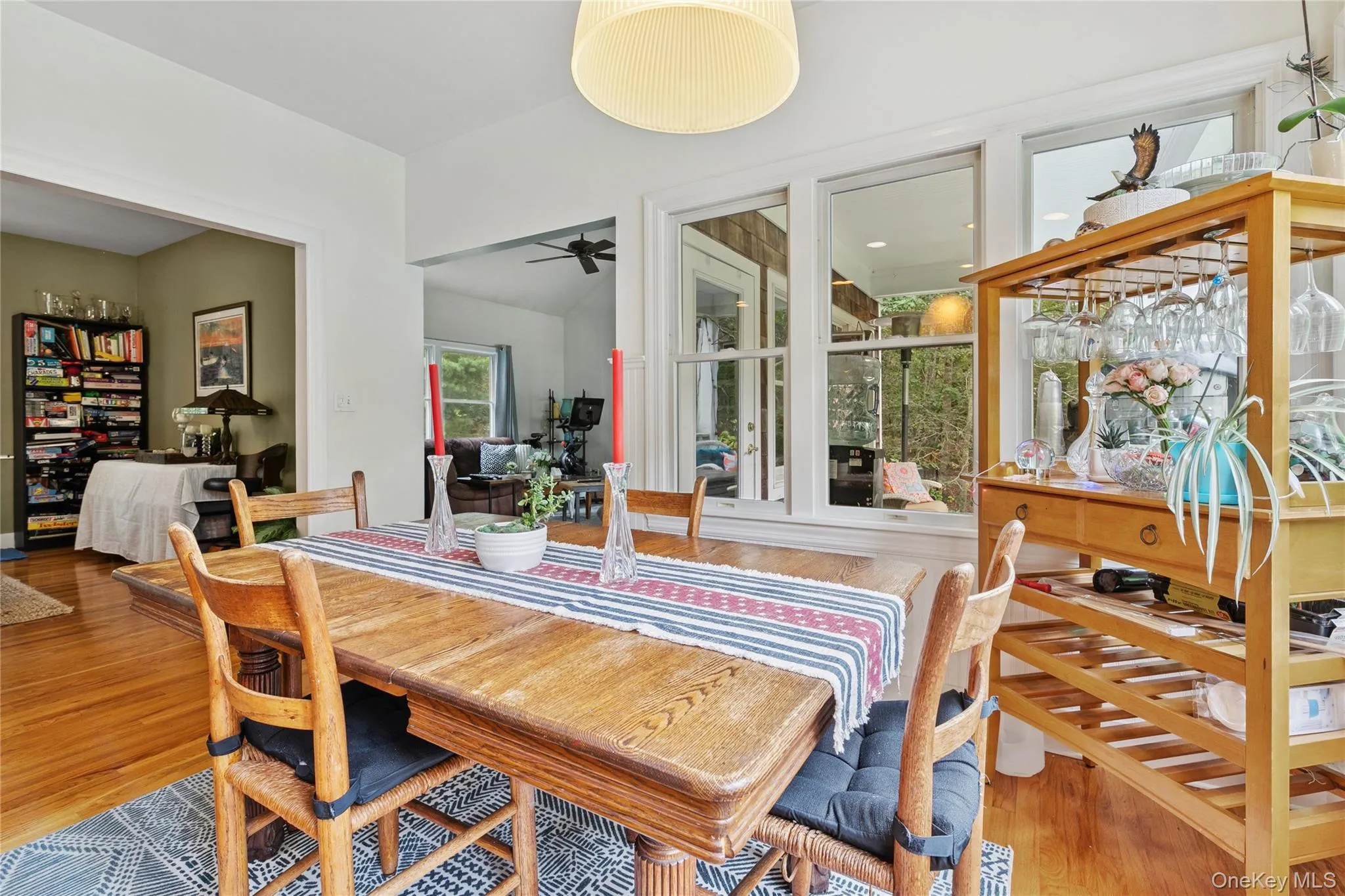 Dining room featuring a ceiling fan and wood finished floors Dining room featuring a ceiling fan and wood finished floors